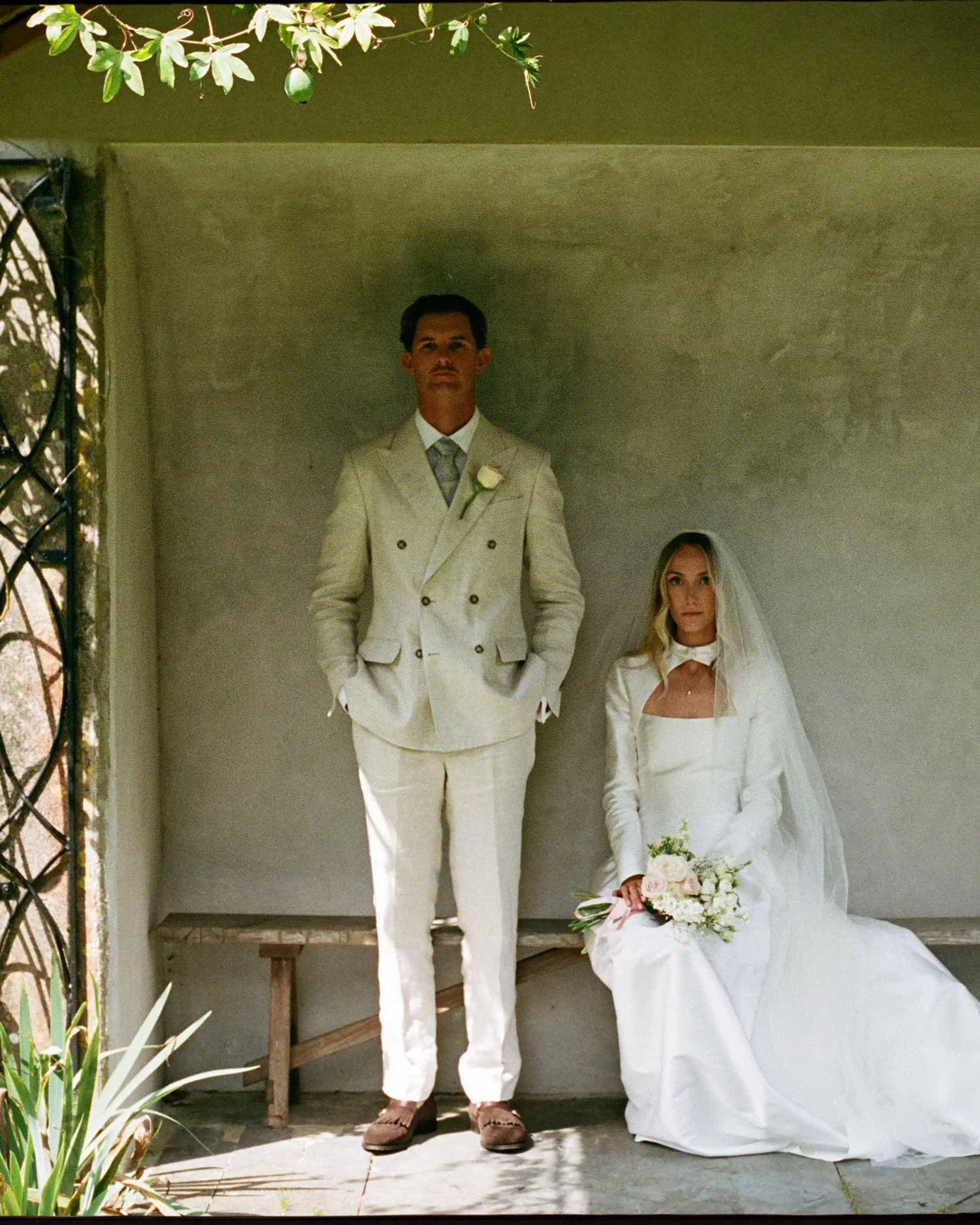 Bride and groom portrait photographed on film in the garden at Boconnoc Estate, Cornwall. Documentary wedding photography by Karl Mackie.