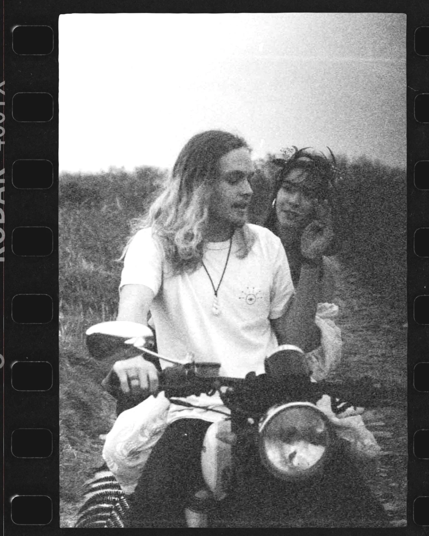 Editorial 35mm film photograph of two people riding a motorbike, analogue lifestyle imagery by Karl Mackie