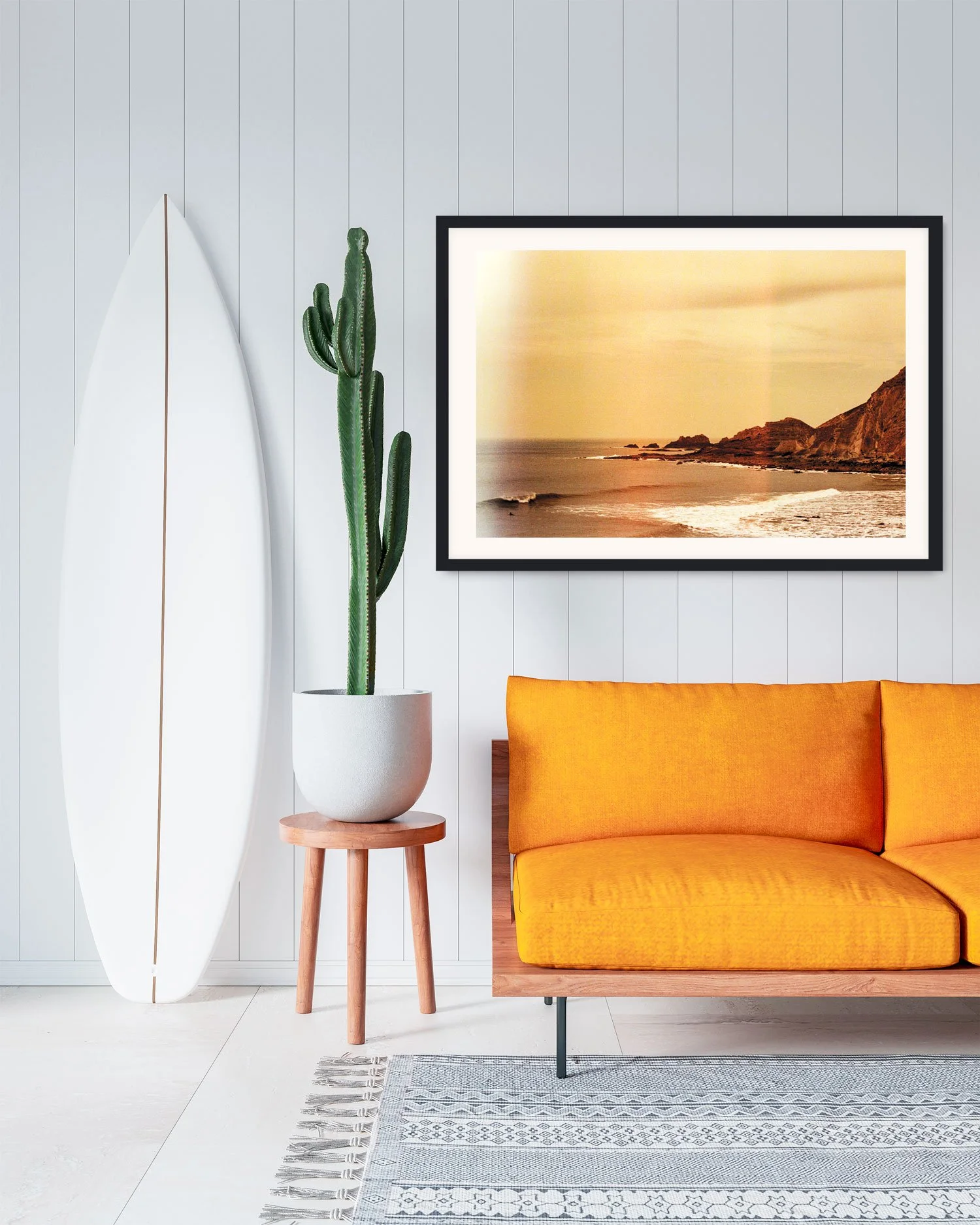 Framed Hartland coastal film print by Karl Mackie displayed in a modern interior