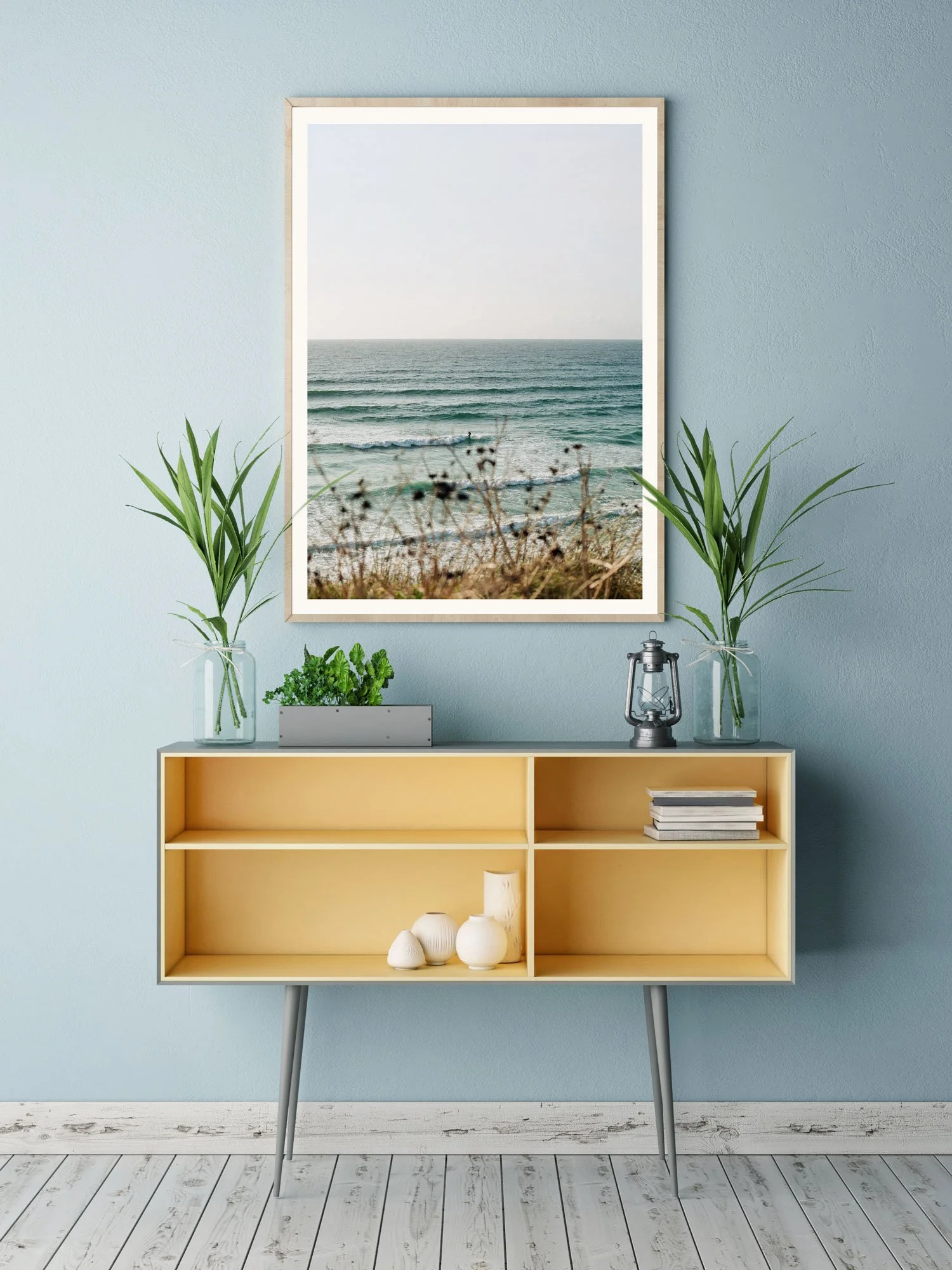 Framed Headland coastal print by Karl Mackie displayed in a minimal interior