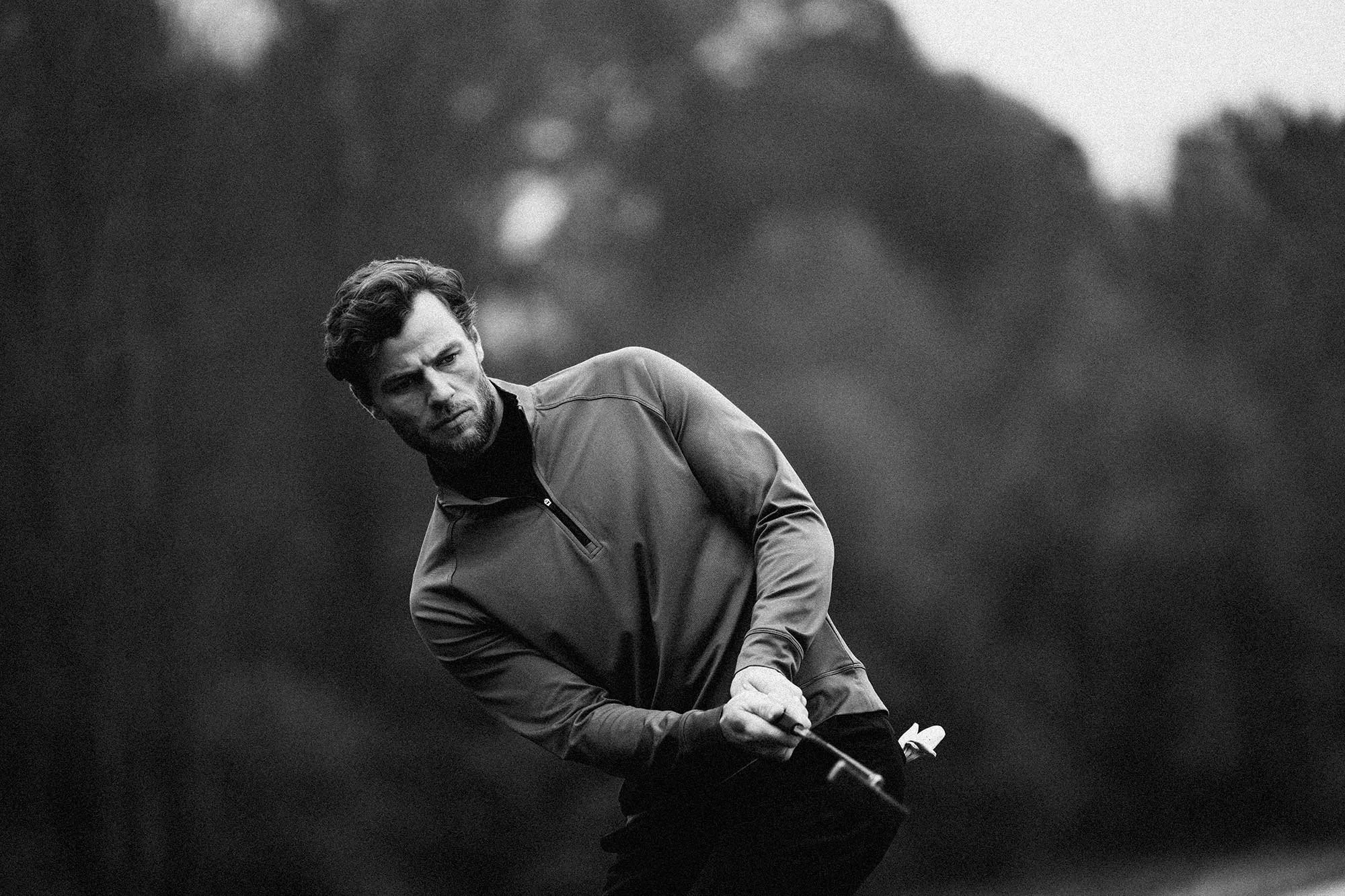 Black and white portrait of golfer during a swing