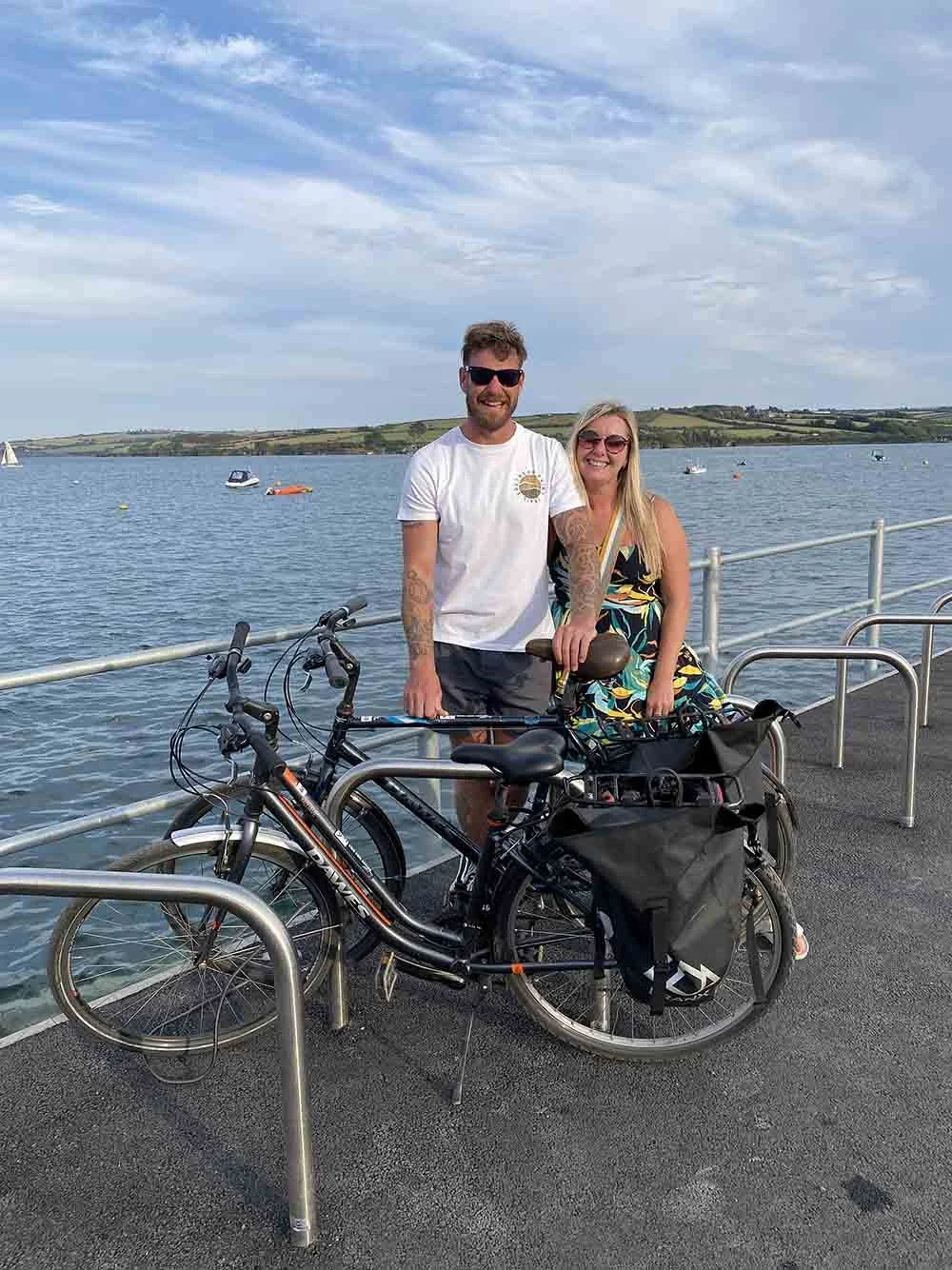 Couple returning to their bikes after an evening in Padstow