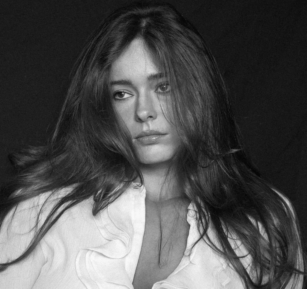 Portrait press shot of Ellysse Mason in black and white.