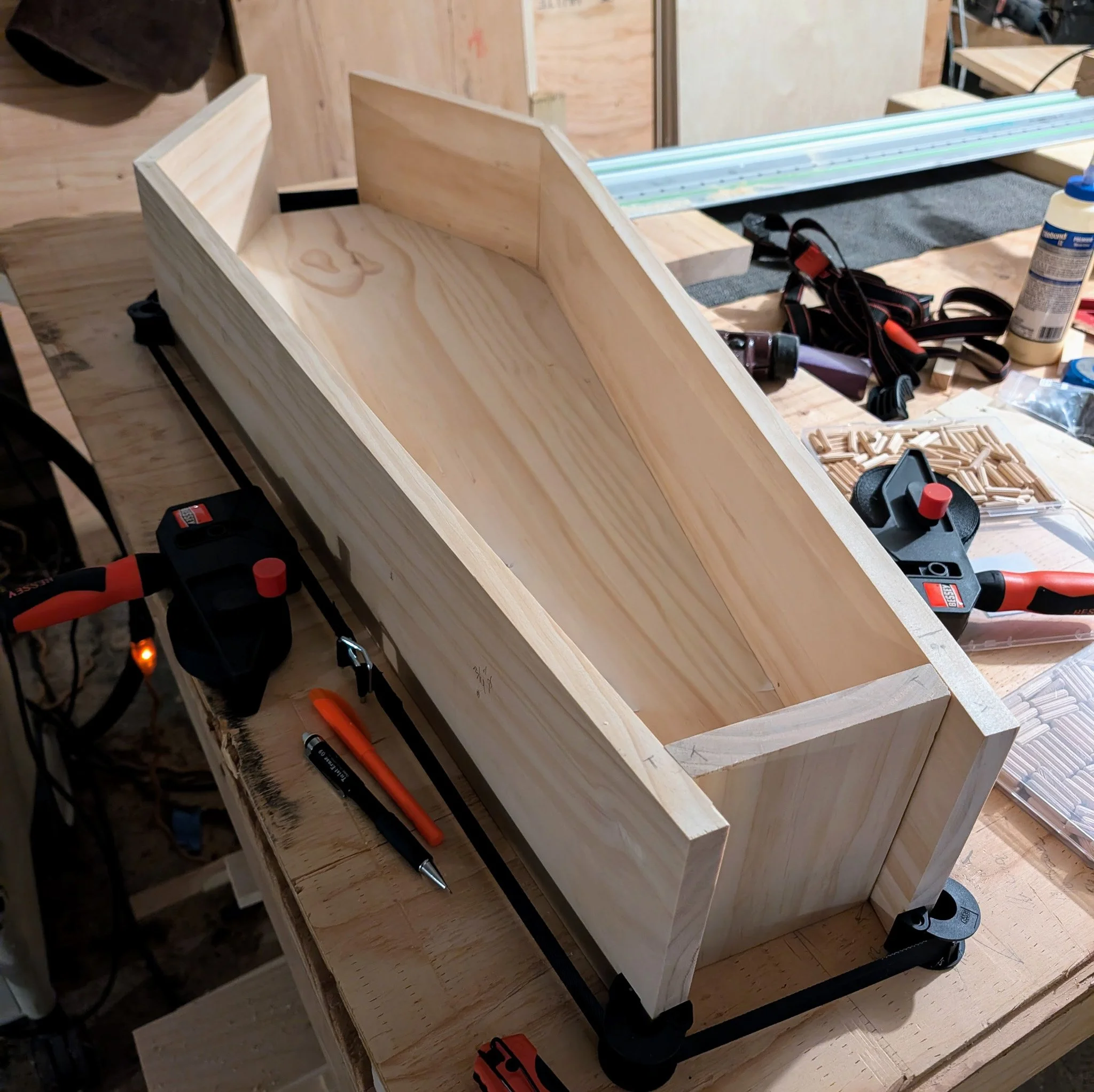 The casket is close. The head piece (currently missing in this image) will be white oak to match the base.