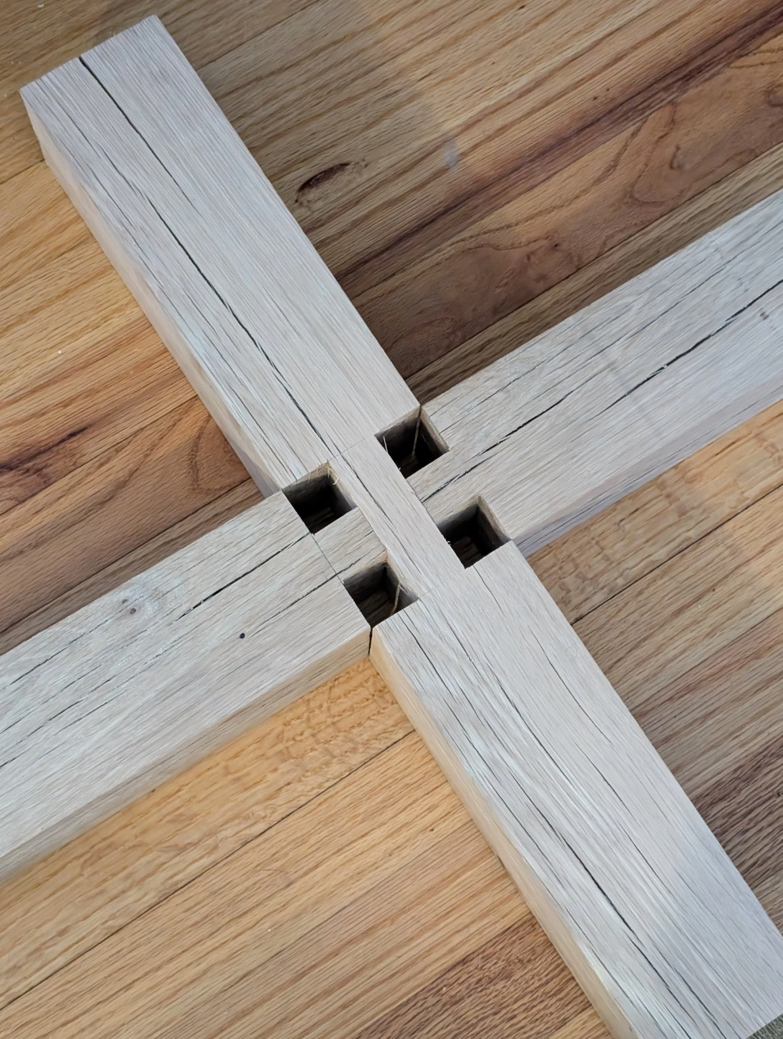 Jay Allard, my collaborator built a white oak base using traditional joinery techniques. Here are the feet where the post will be inserted.