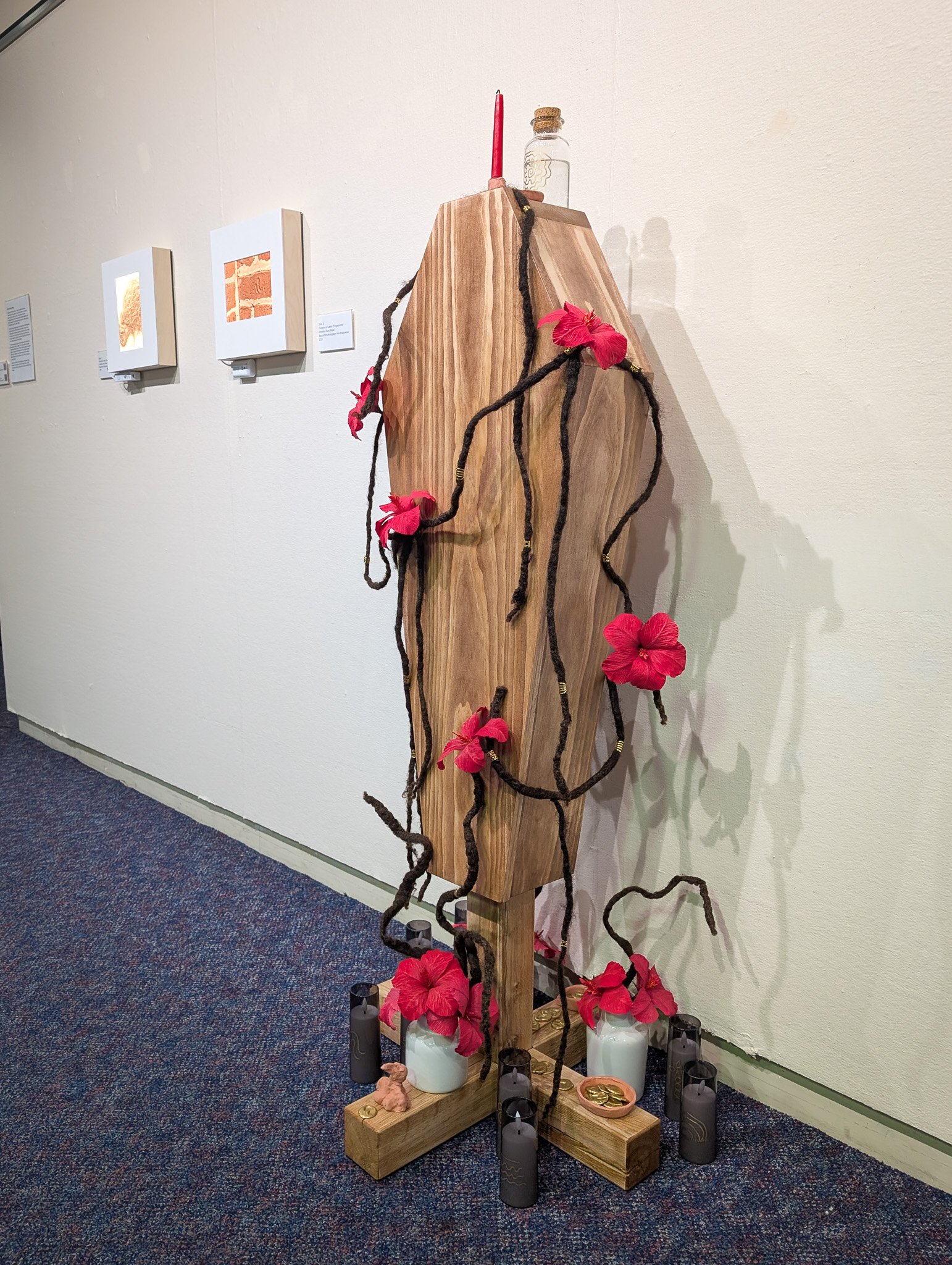 "Reclamation" (2026) installed at UMB Archive. Hair, clay, paper, and other media