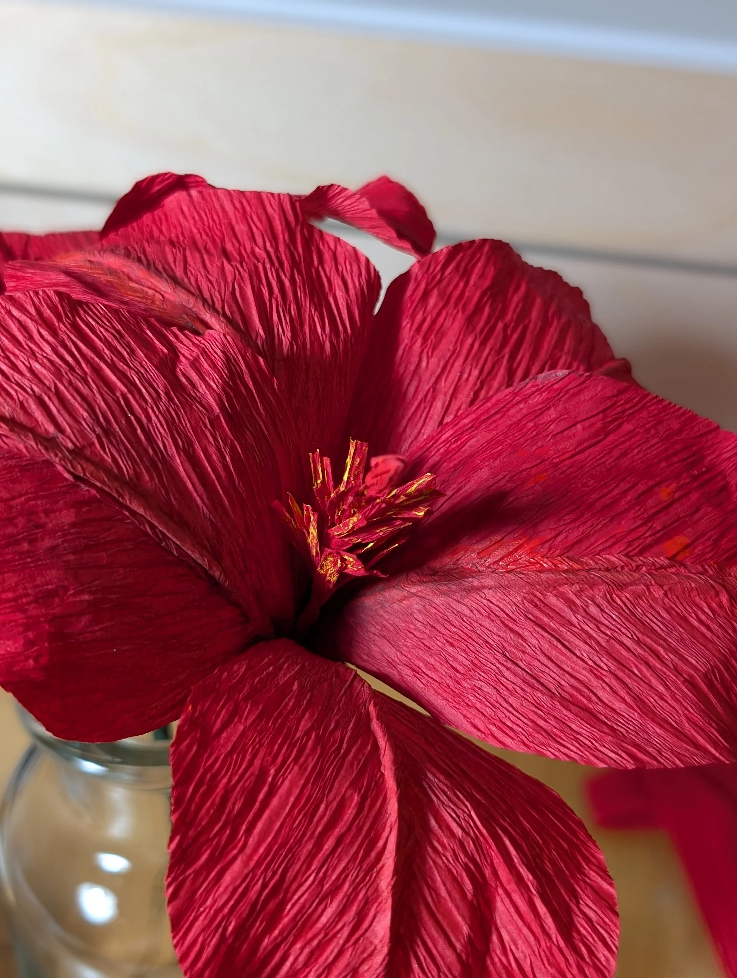 Handmade paper hibiscus flower, common in the global south and the national flower of Sudan.