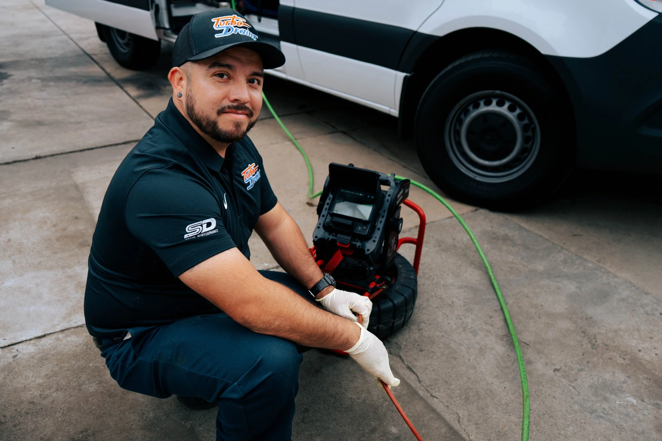 A technician using a sewer camera.