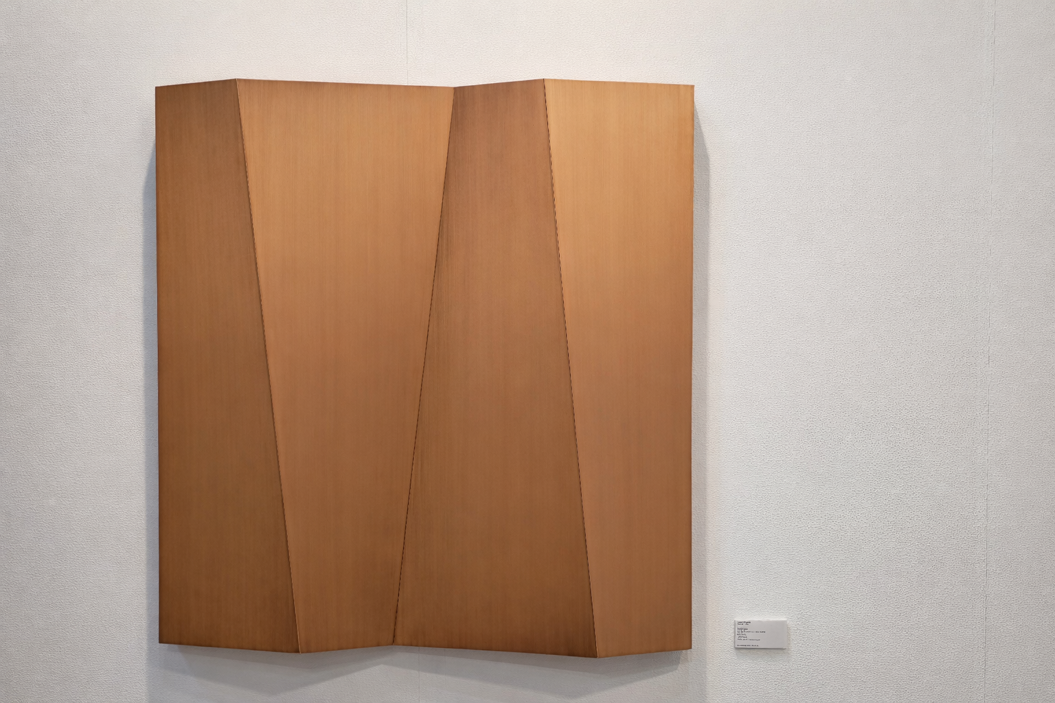Sculptural copper wall panel with folded planes, AmorettiLAB wall art
