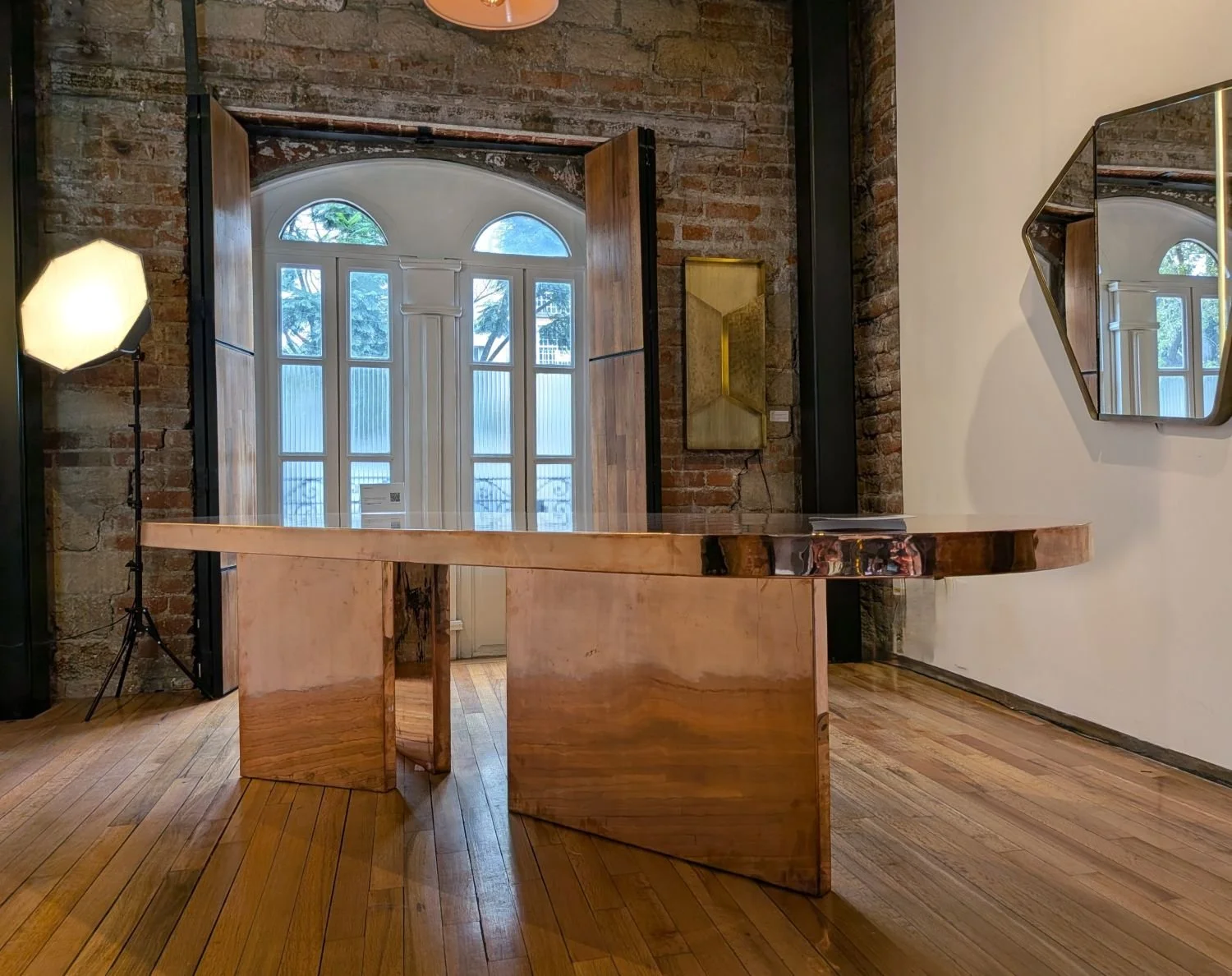 Finished Elipsis dining table in polished copper by AmorettiLAB