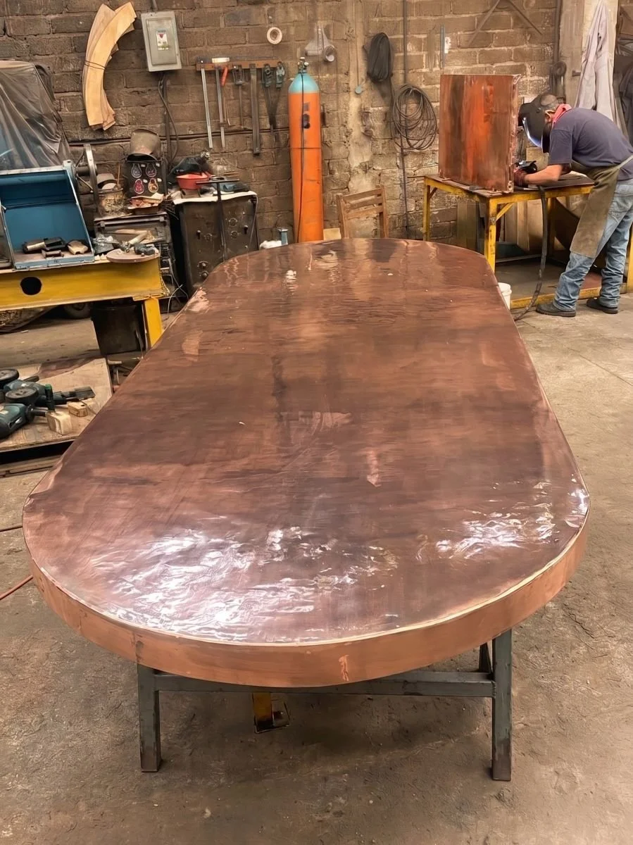 Elipsis copper table top in production at the AmorettiLAB workshop, Mexico City
