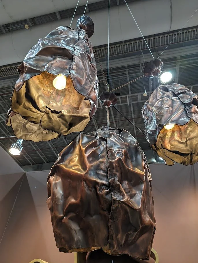 Sculptural hand-formed metal pendant lights by AmorettiLAB