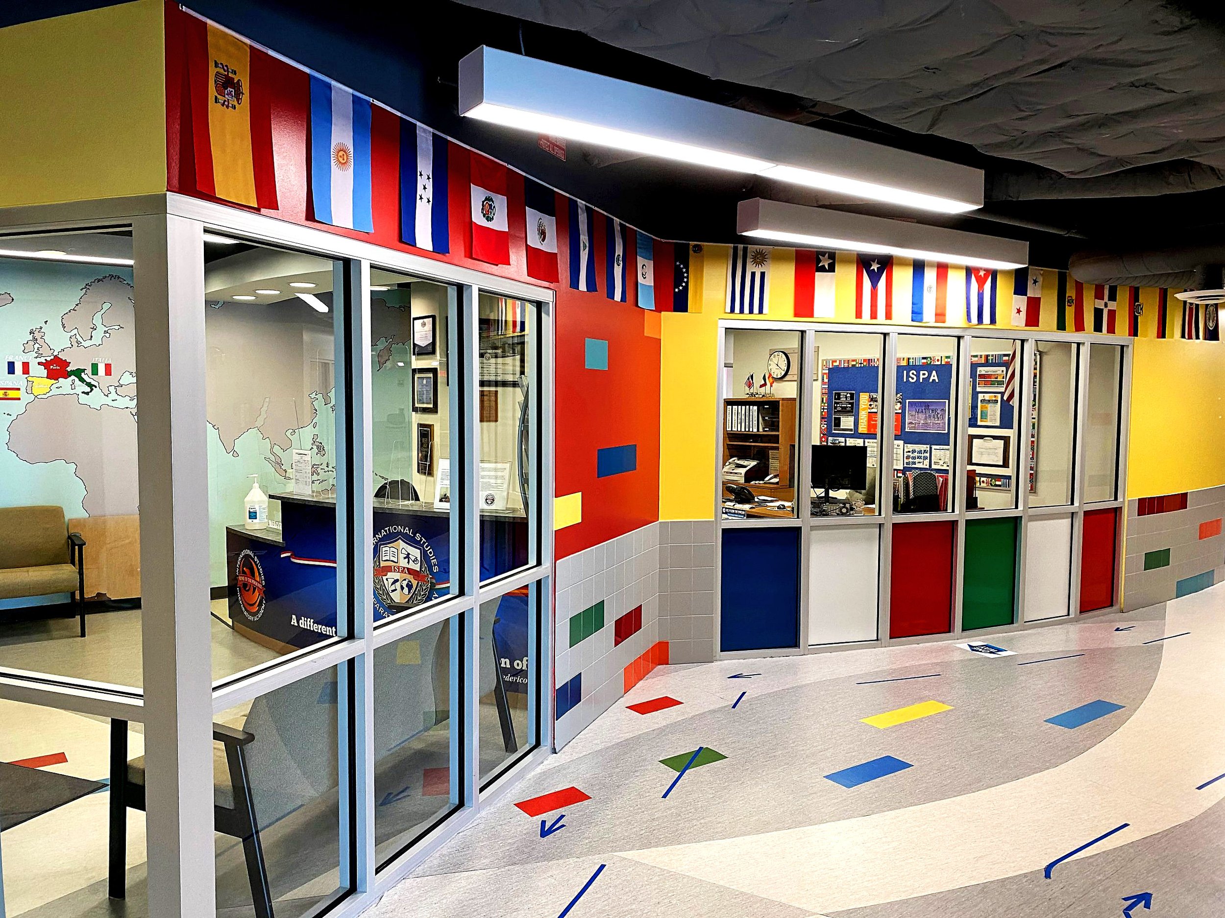 School hallway with colorful decor and international flags.