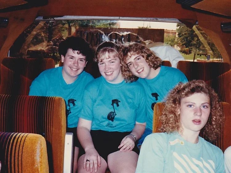 1989-girls+on+the+caravan+bus.jpg.webp