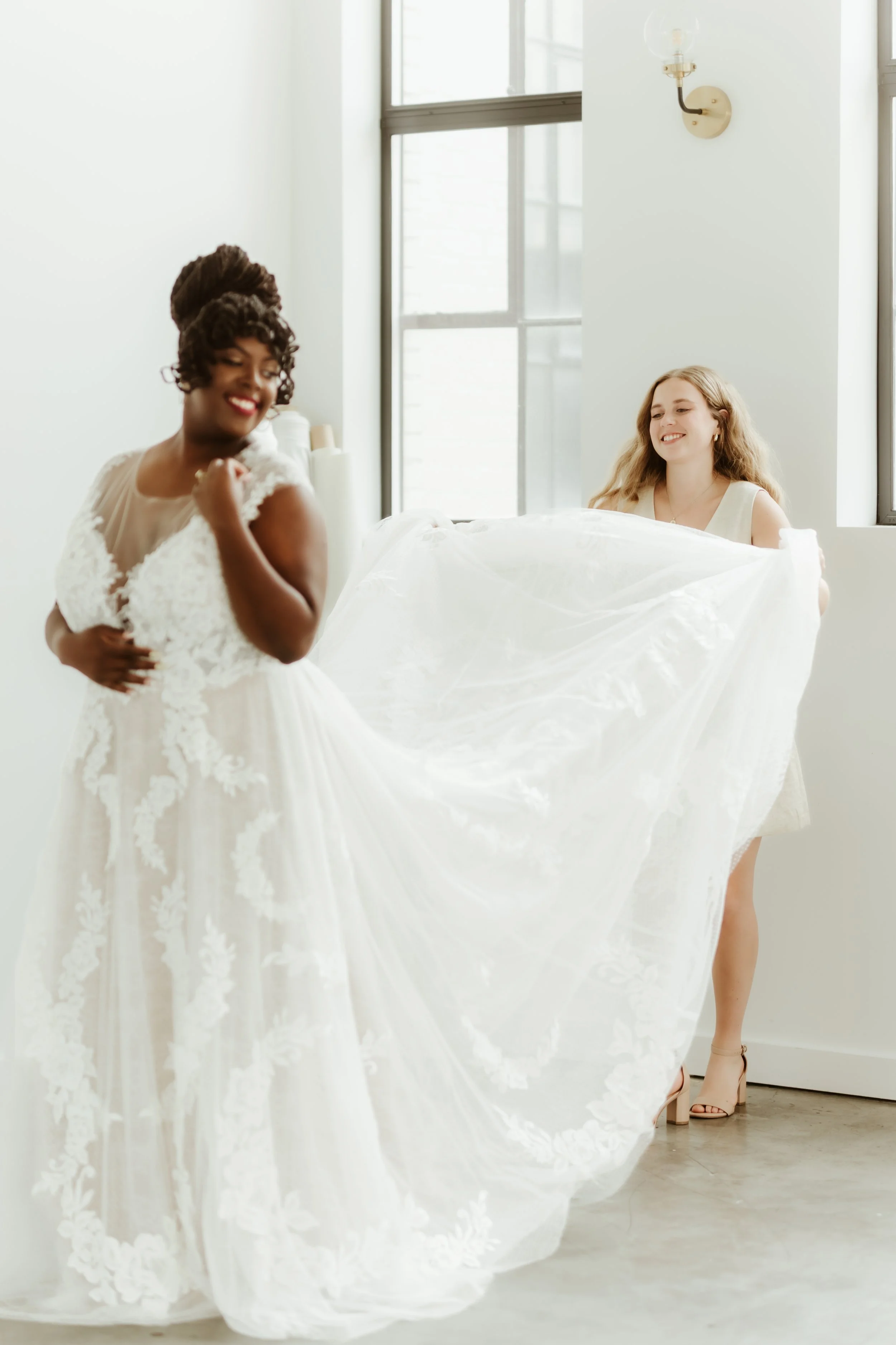 A girl fluffing a brides train, smiling and laughing with text over the picture saying "what we do, services"