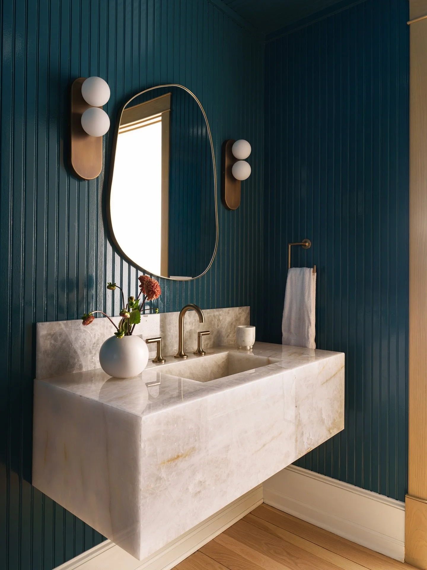 Powder room at our La Jolla project &bull; Deep teal beadboard, sculptural brass lighting, and a carved onyx vanity make for a space that feels moody, layered, and timeless.

Design @sarahtract 
Photo @furman.interiors 
Styling @californiacasa 

#LaJ