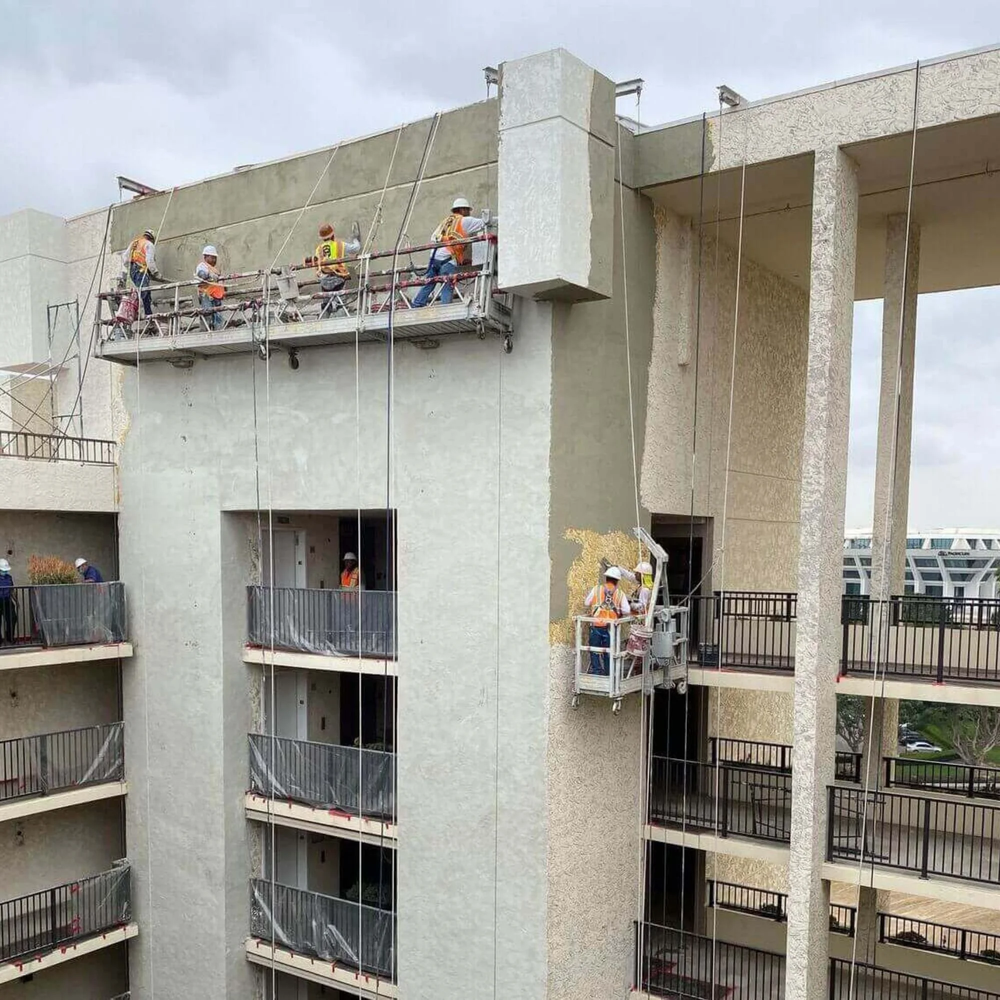 Pilot Painting resurfacing a hotel exterior and updating the exterior to a more modern design.