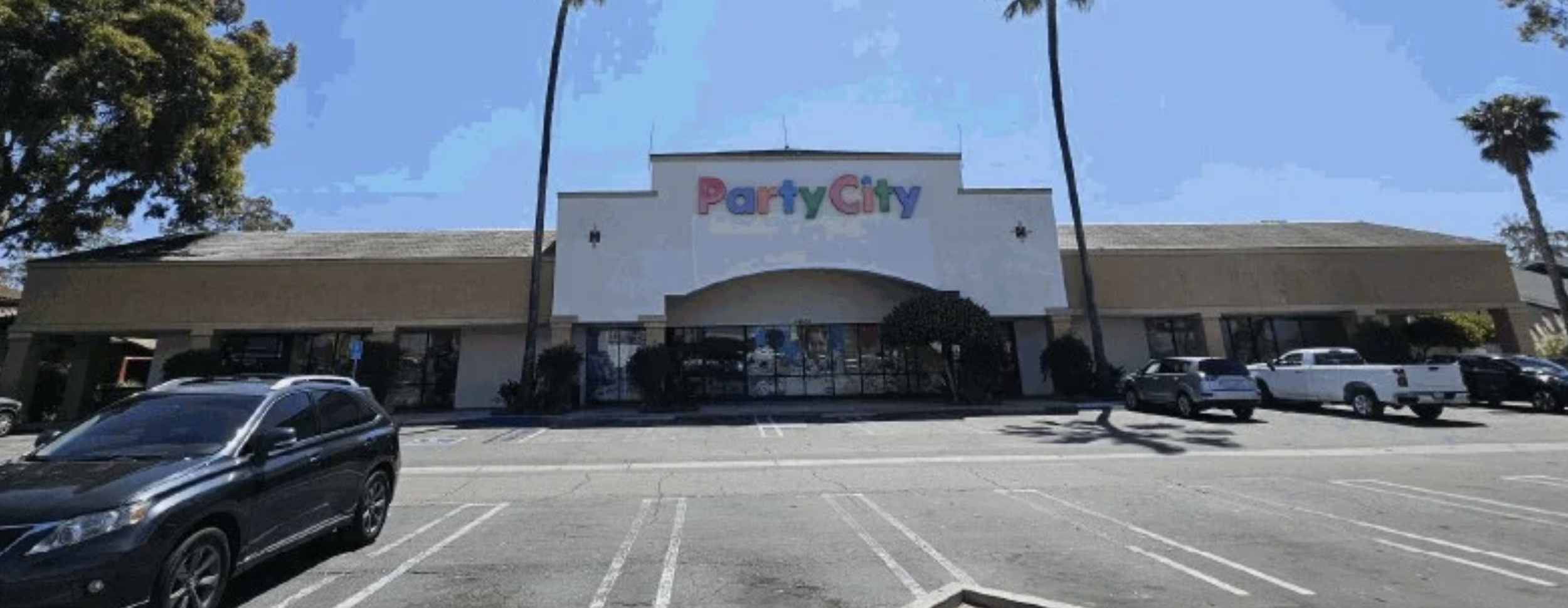 Before repaint on Retail center in Huntington Beach, Ca