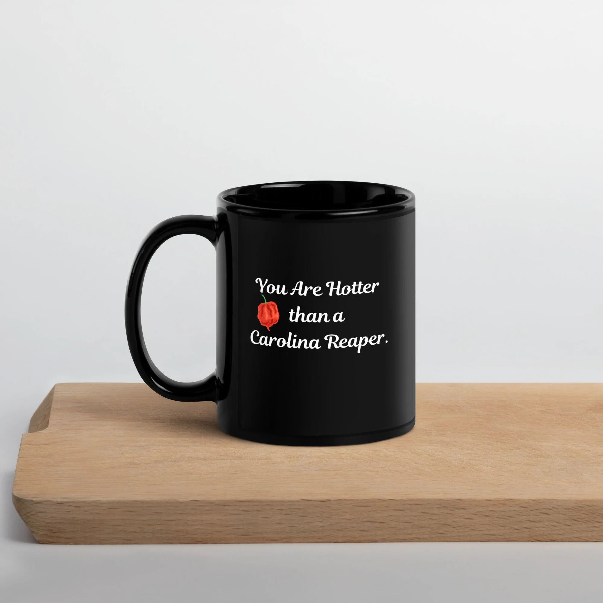 black-glossy-mug-black-11-oz-handle-on-left-657f5baa1f7e4.jpg