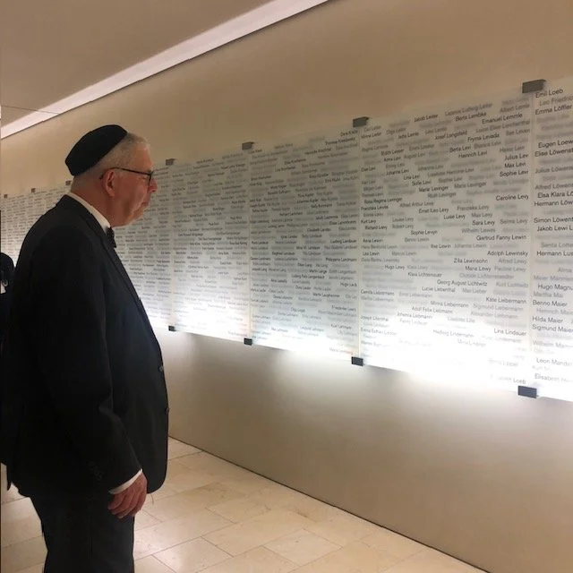 Rabbi and memorial to victims of the Holocaust.jpg