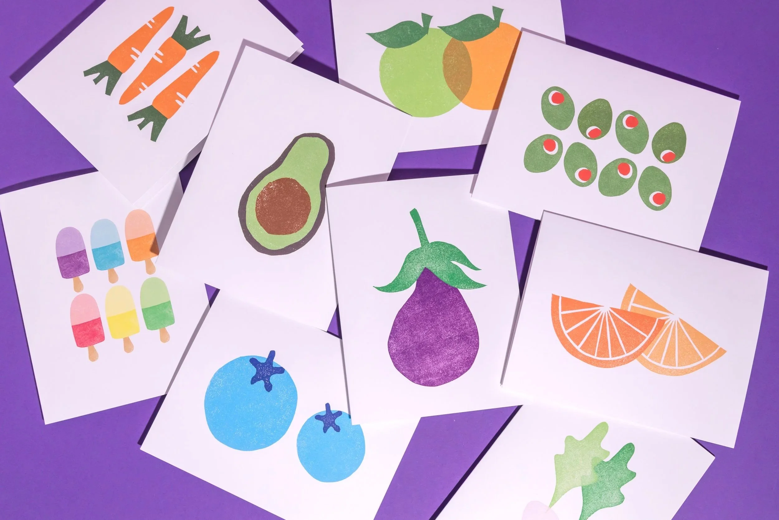 Linocut cards designed by Andrea Morris Studio featuring foods designs