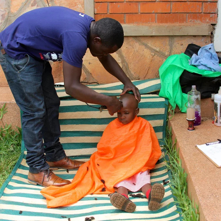 Child getting a haircut.