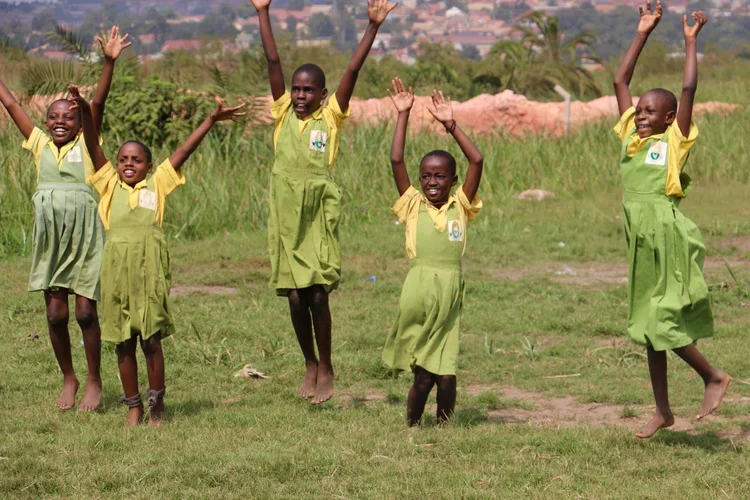 Children Cheering in the Grass