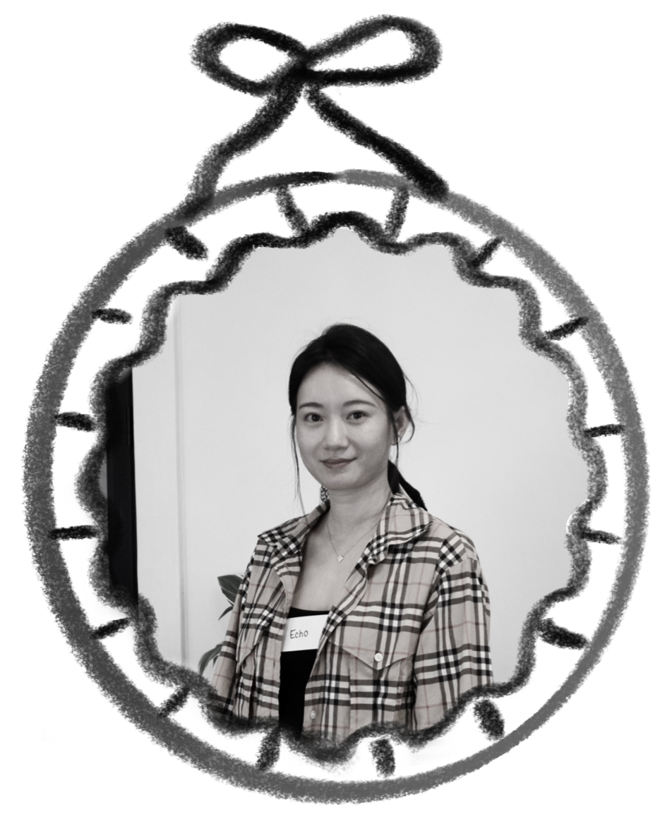 A small, circular black-and-white photograph of a young woman smiling in a plaid blazer in front of a white wall. A hand-drawn frame encircles the photo, making it seem like it is being hung on a wall.