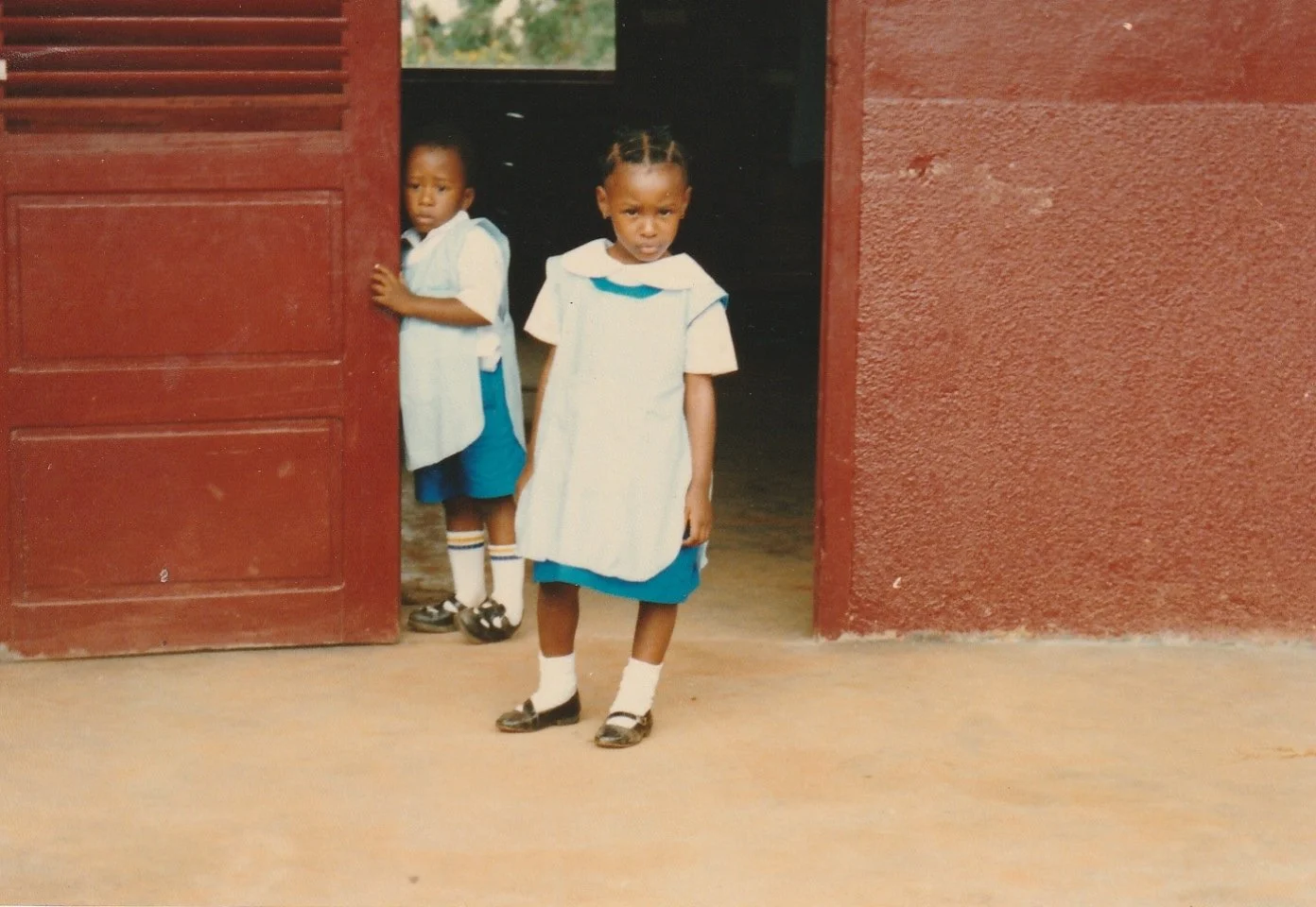 Daisy's older brother and older cousin photographed in their school uniforms (Cameroon, 1980s)