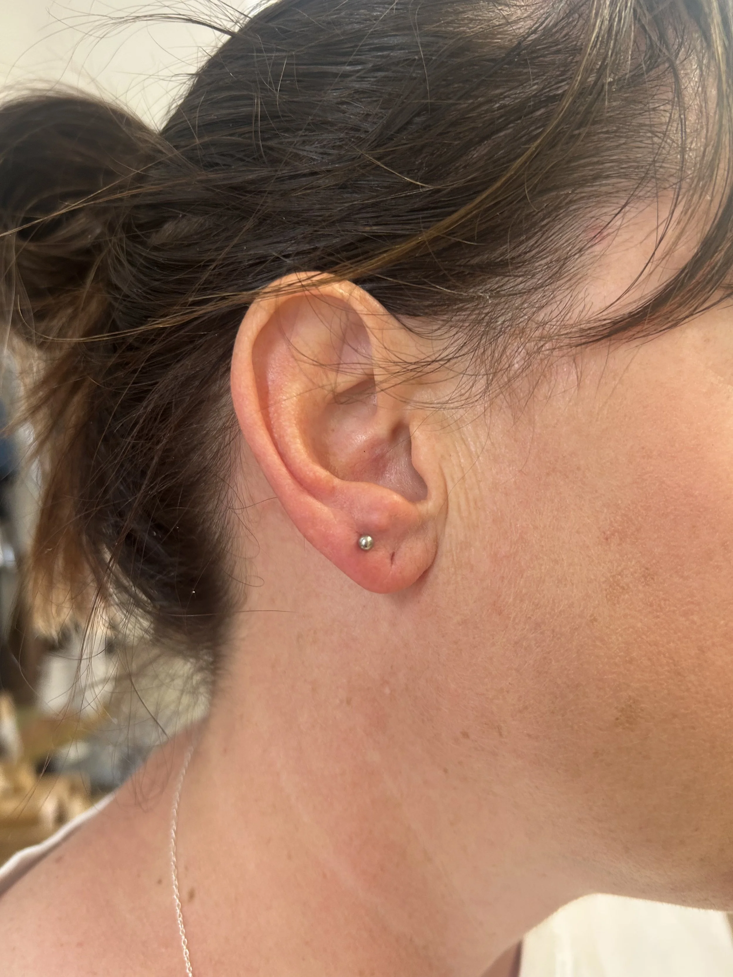 Needle point ear piercing with Chantelle at Laser Luxe and Body Piercing in San Remo, on the Bass Coast