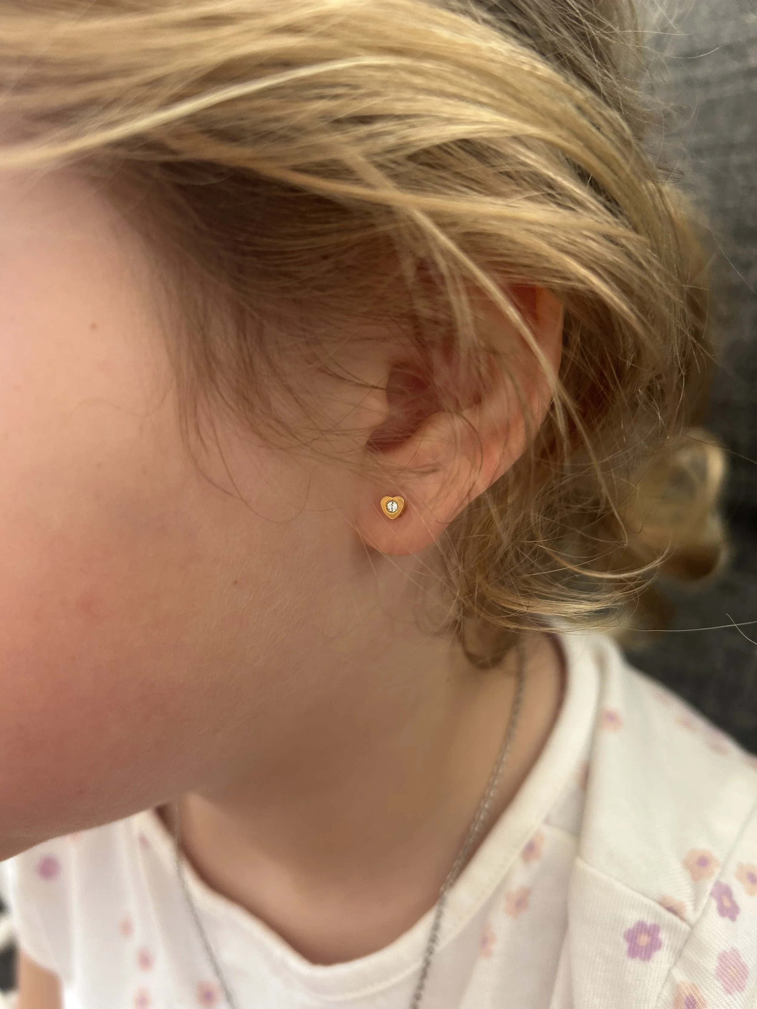 Family friendly kids children's ear piecing by Chantelle at Laser Luxe and Body Piercing in San Remo, on the Bass Coast