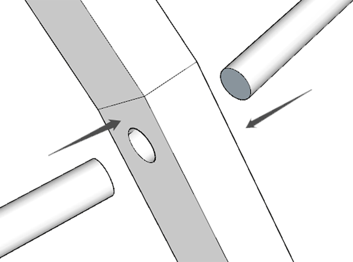 Diagram showing the assembly of a metal part with two cylindrical rods inserted into a rectangular base with a hole.
