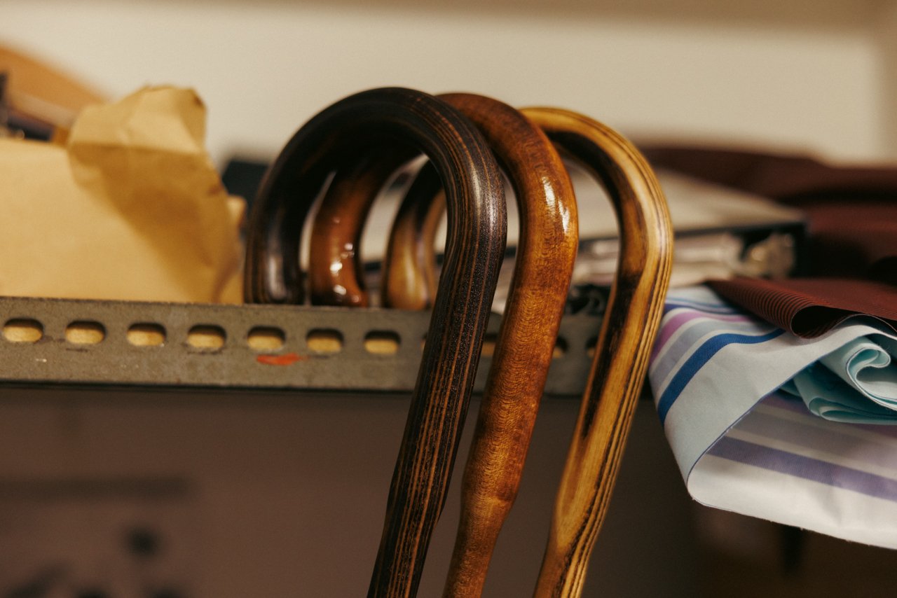 View of several classic polished wooden crook handles stored neatly together.