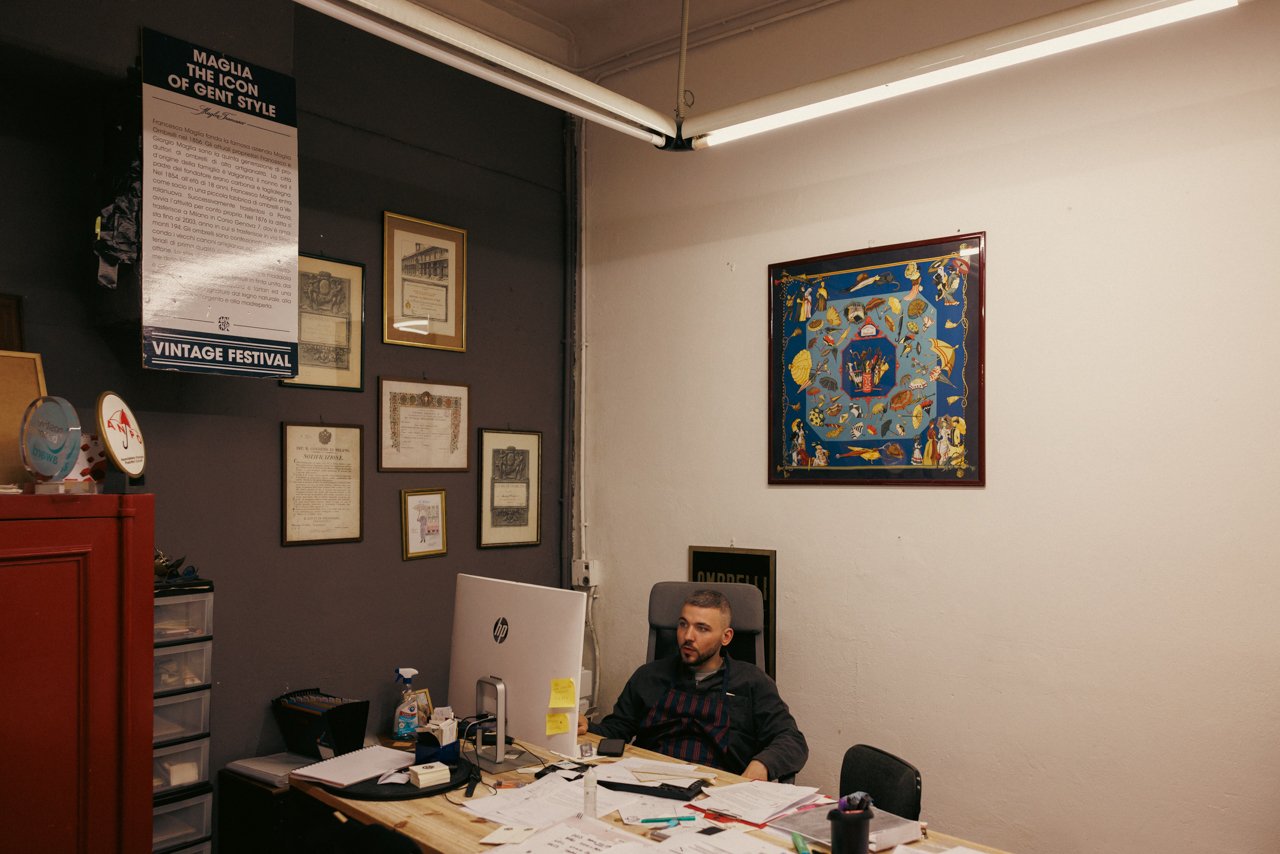 CEO Francesco Maglia seated at his desk in the office section of the Maglia Francesco atelier.