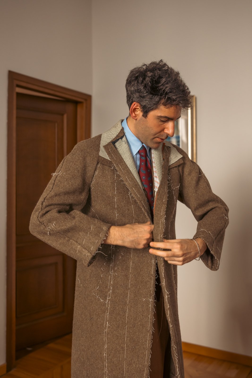 Gianfrancesco Musella-Dembech undergoing a basted fitting for a bespoke jacket.
