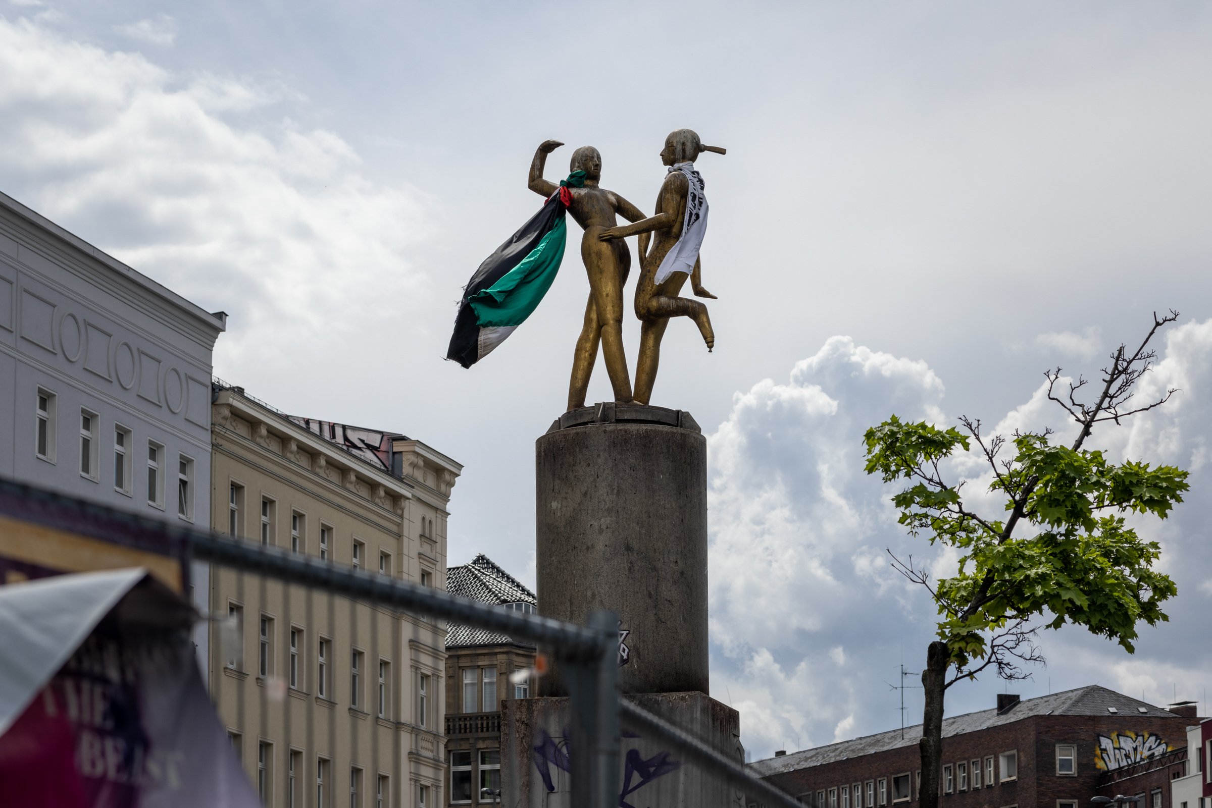 Palestinian flags draped over a monument at Hermannplatz during a pro-Palestine demonstration, Neukölln, Berlin, May 2021