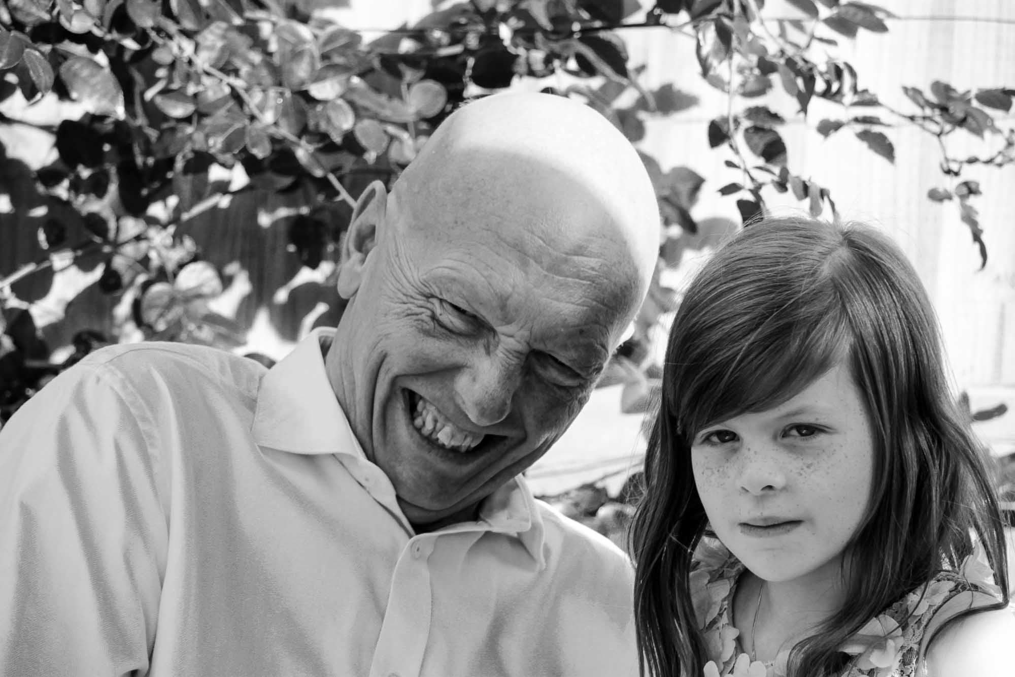 black-and-white-photgraphy-grandad-with-grandaughter-smiling.jpg