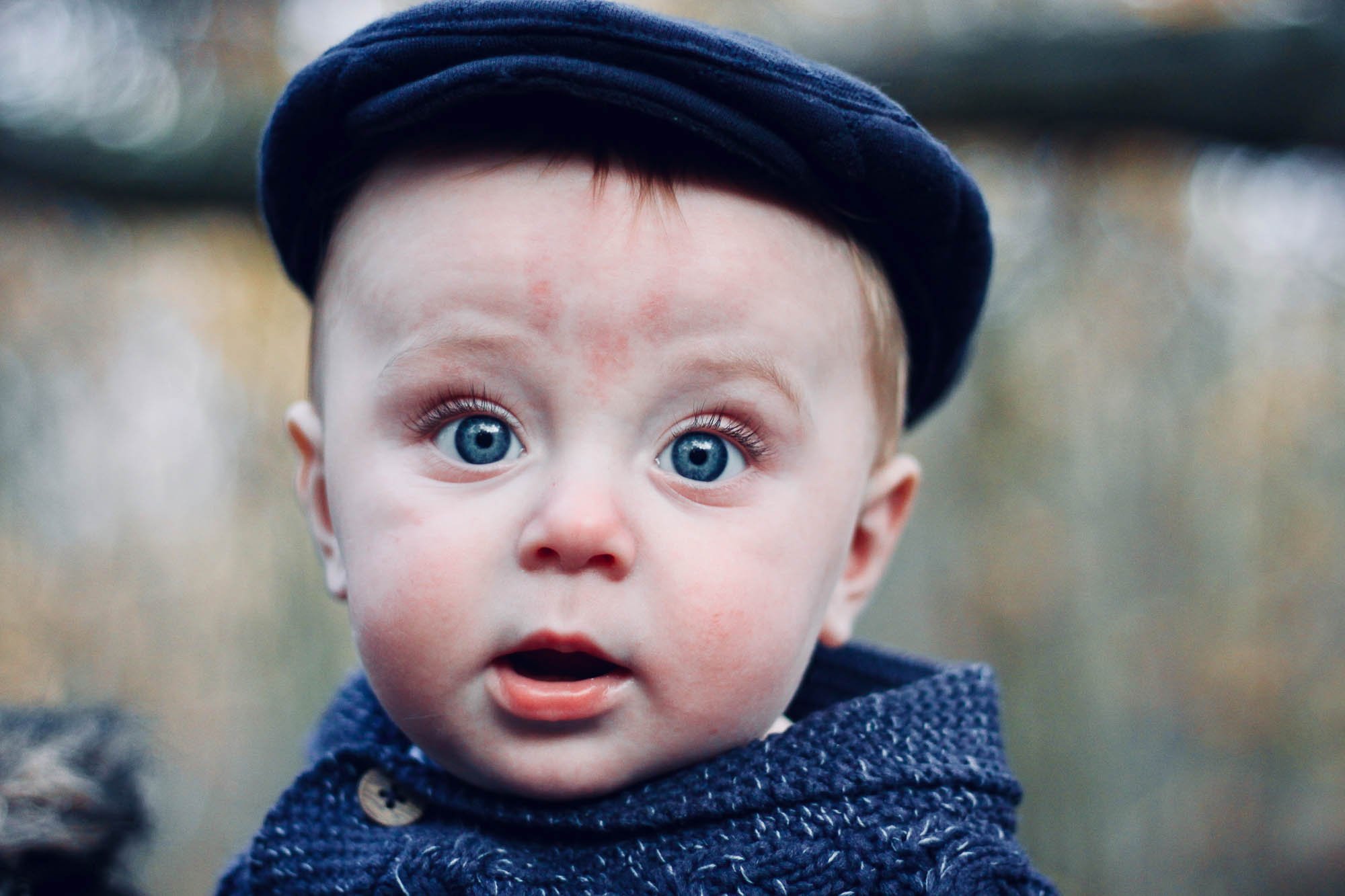 baby-photography-young-boy-in-blue-flatcap-with-blue-eyes.jpg