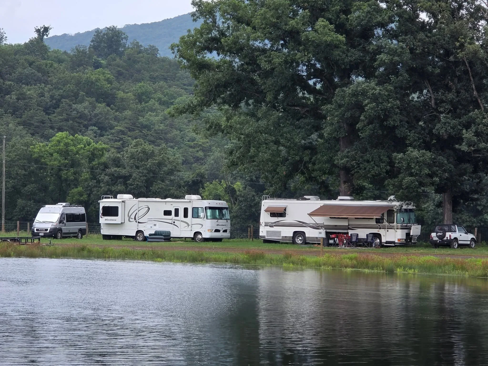 Bluegrass festival 2025 pic pond and campers.jpg