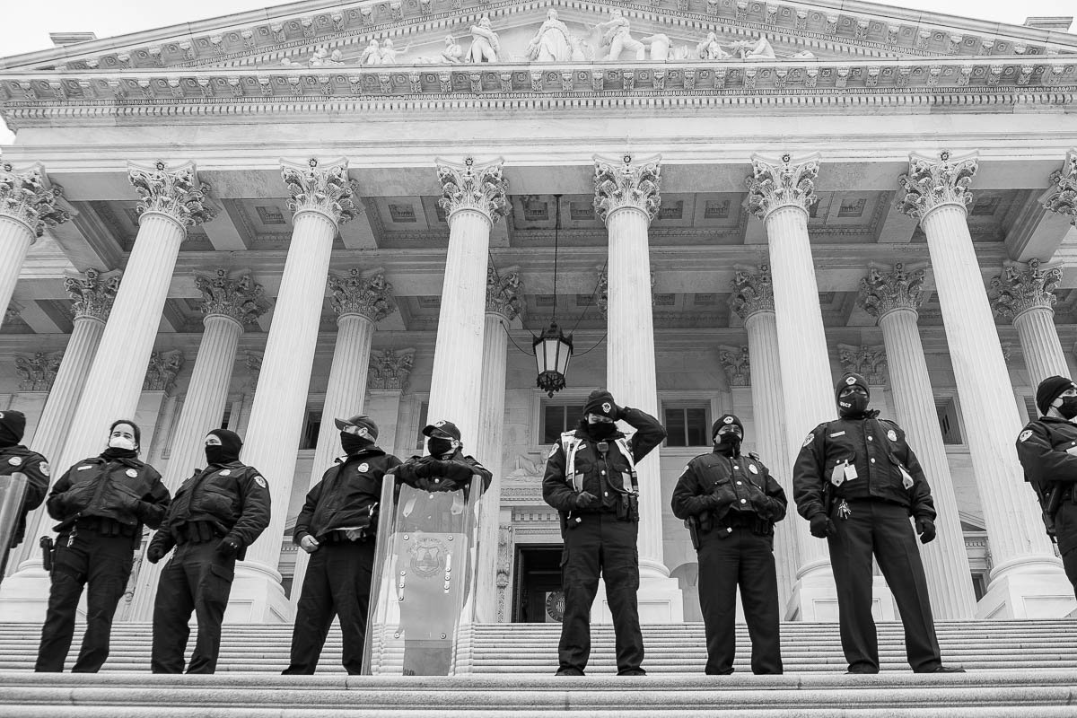 Capitol Police swiftly secure the perimeter, after moving individuals away from the west entrance of the Capitol, upholding safety and order after the Capitol siege. January 6, 2021, Washington D.C.