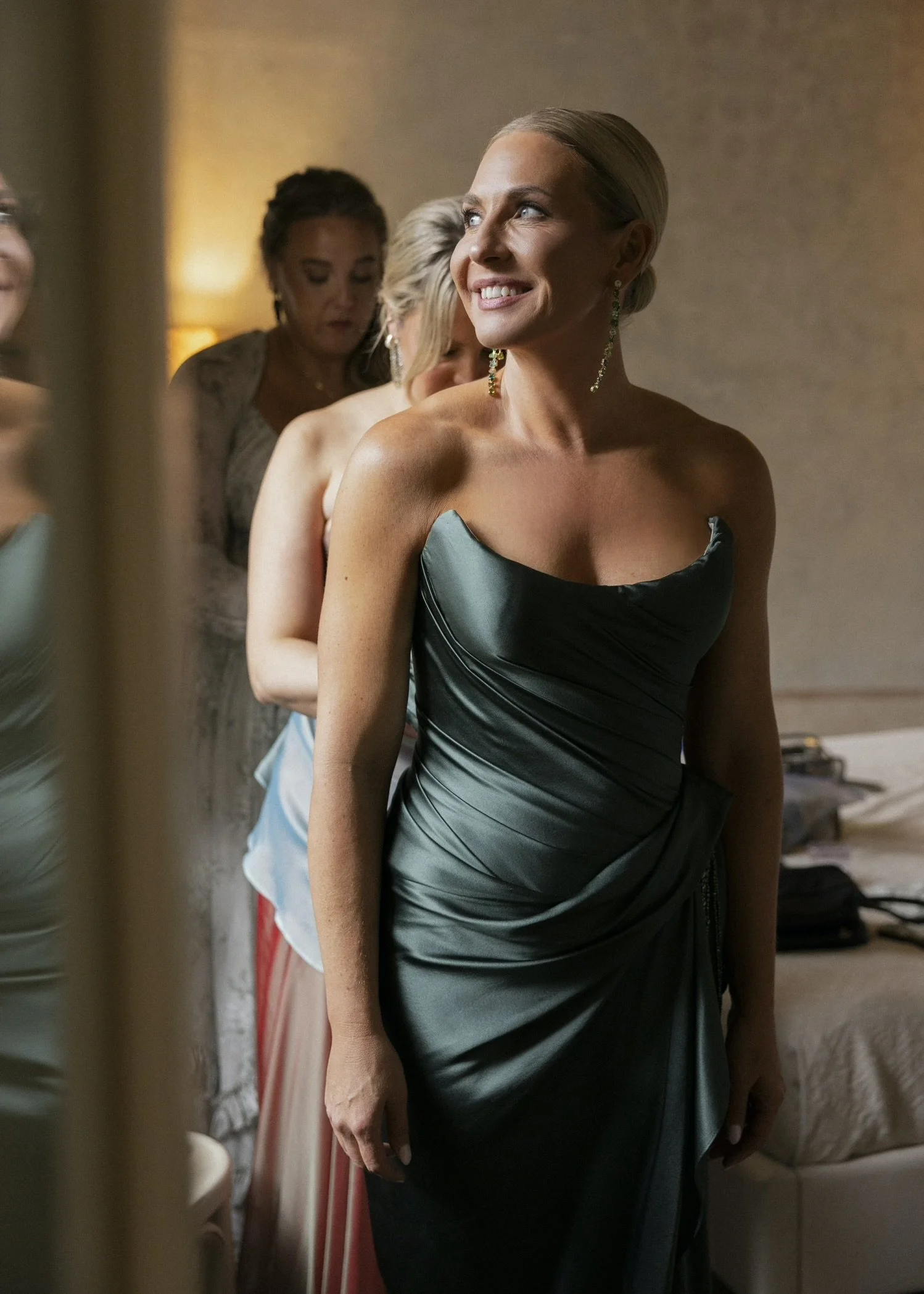 Happy client wearing her custom couture strapless modern distinctive sculptural gown made with Bodice Tech by Angeline Brunk in Seattle where all her dresses are made in King County in the United States.