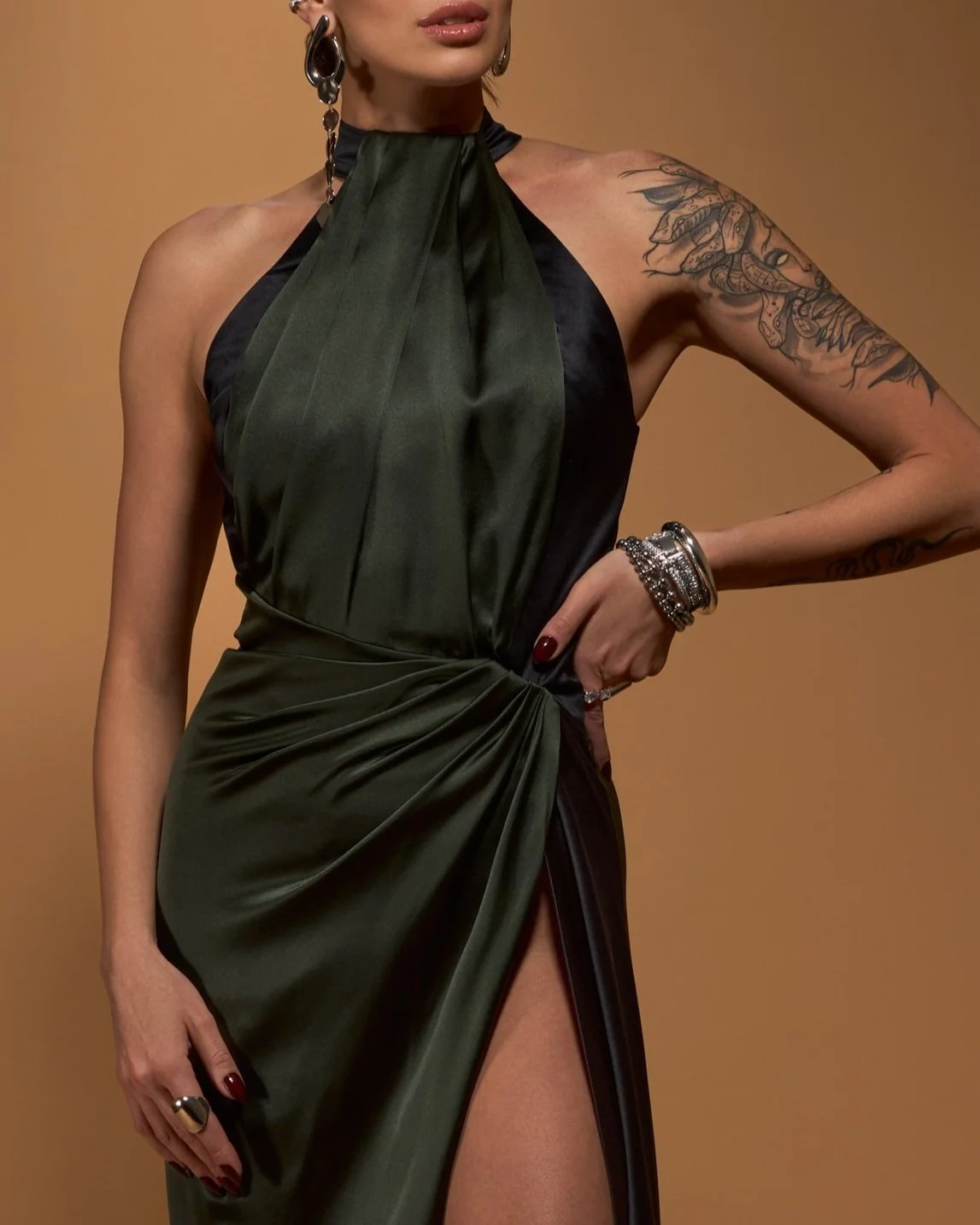 High neck black and green silk charmeuse dress with a thigh high slit and flattering draping at the skirt waist and neckline by Seattle couture designer Angeline Brunk
