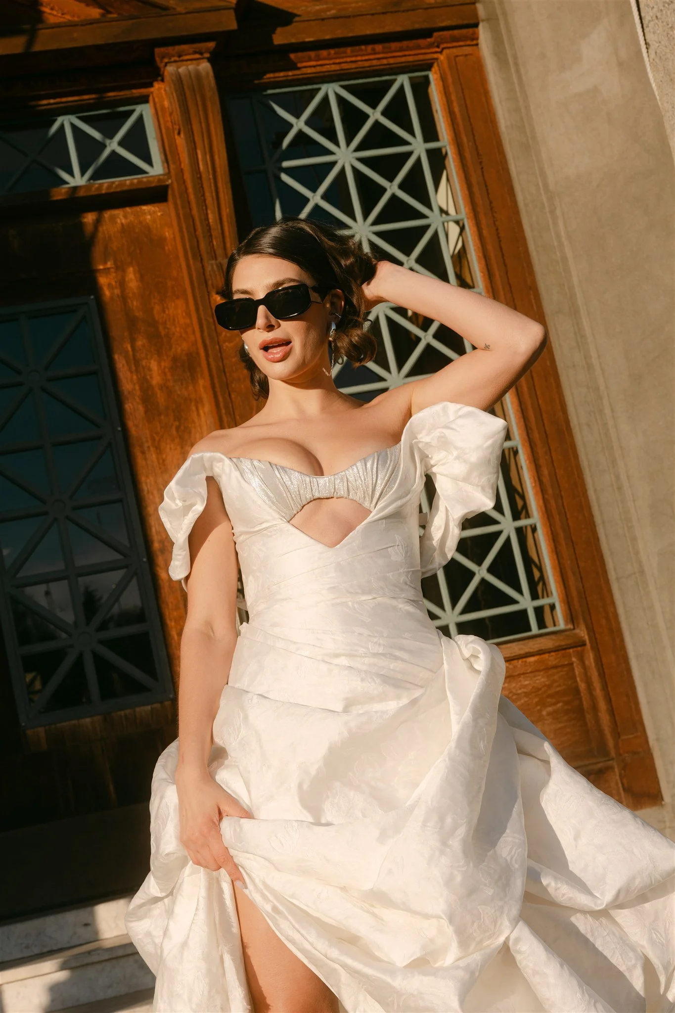 Zinovia Gown by Angeline Brunk in Italian jacquard and silver silk lamé featuring a bralette detail with cutout bodice and sculptural off the shoulder detail draping. Photographed by Lauren New