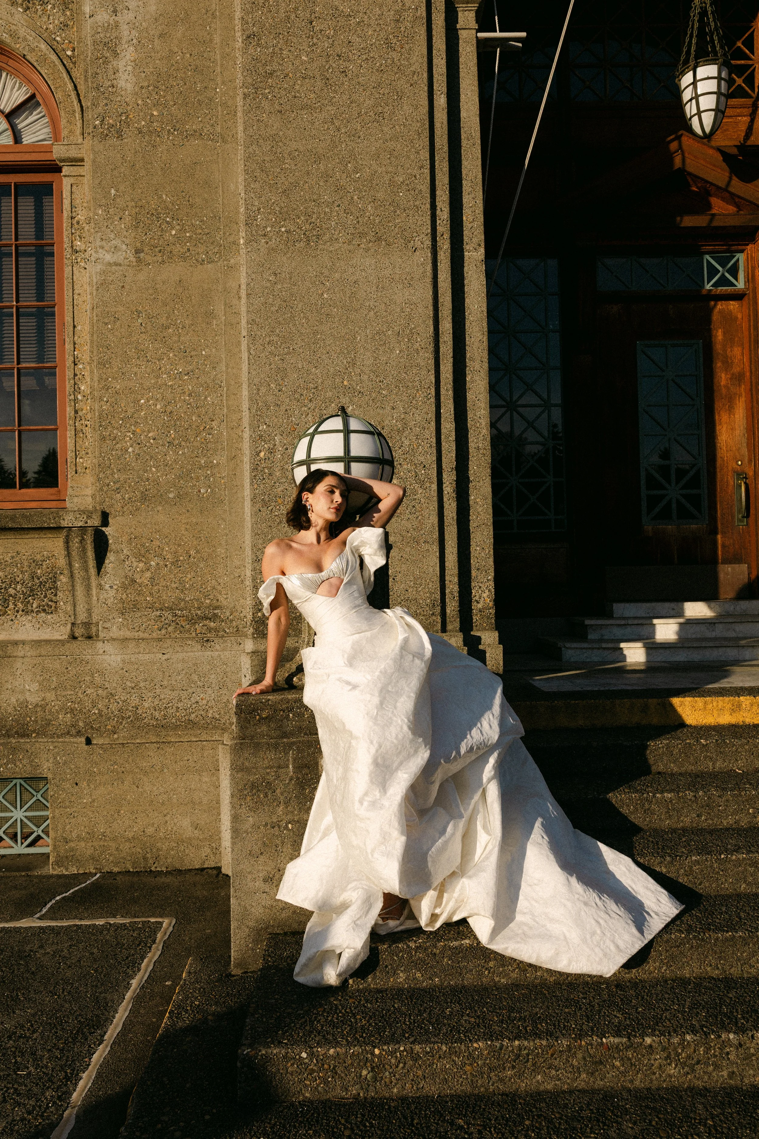The Zinovia Gown by designer Angeline Brunk featuring a dramatic silver ruched bralette and draped skirt in Italian jacquard.