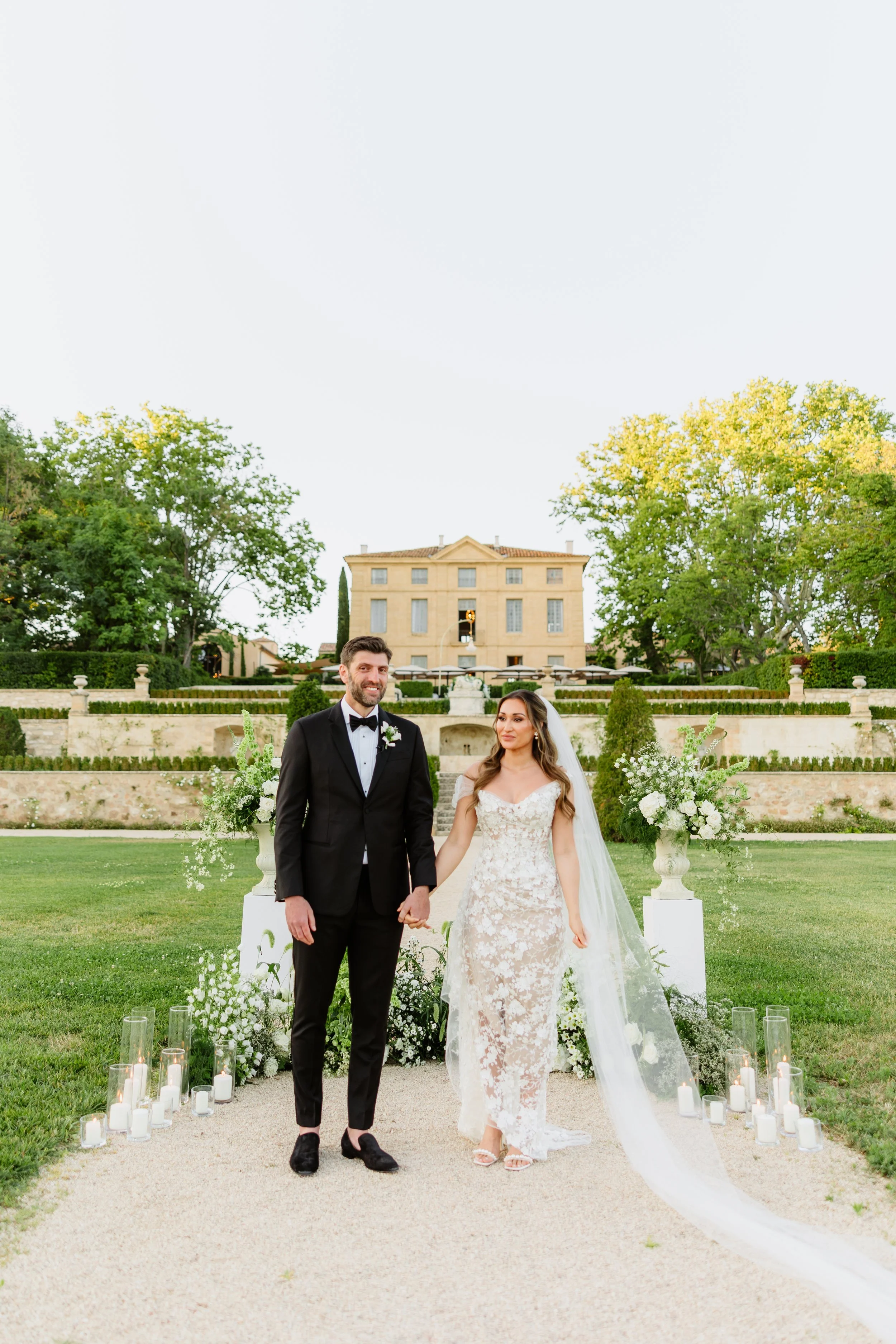 Couture bride on her wedding day in Provence, France in a custom wedding dress by Seattle Designer Angeline Brunk made in Washington Seattle in luxury lace and silk, photographed by Milos Gavrilovic Weddings.