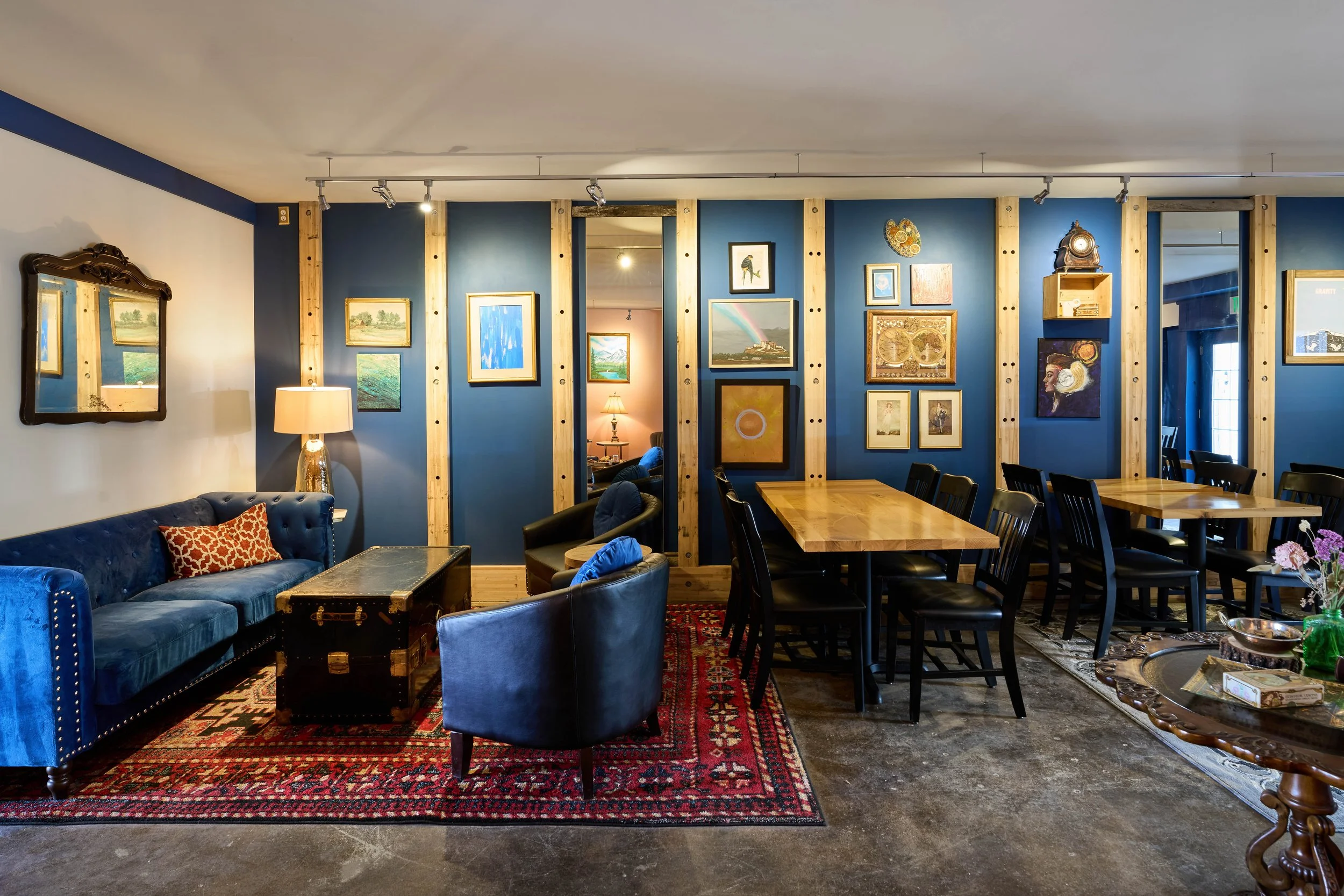 Broderick’s main room with blue lounge seating and tables for private events.