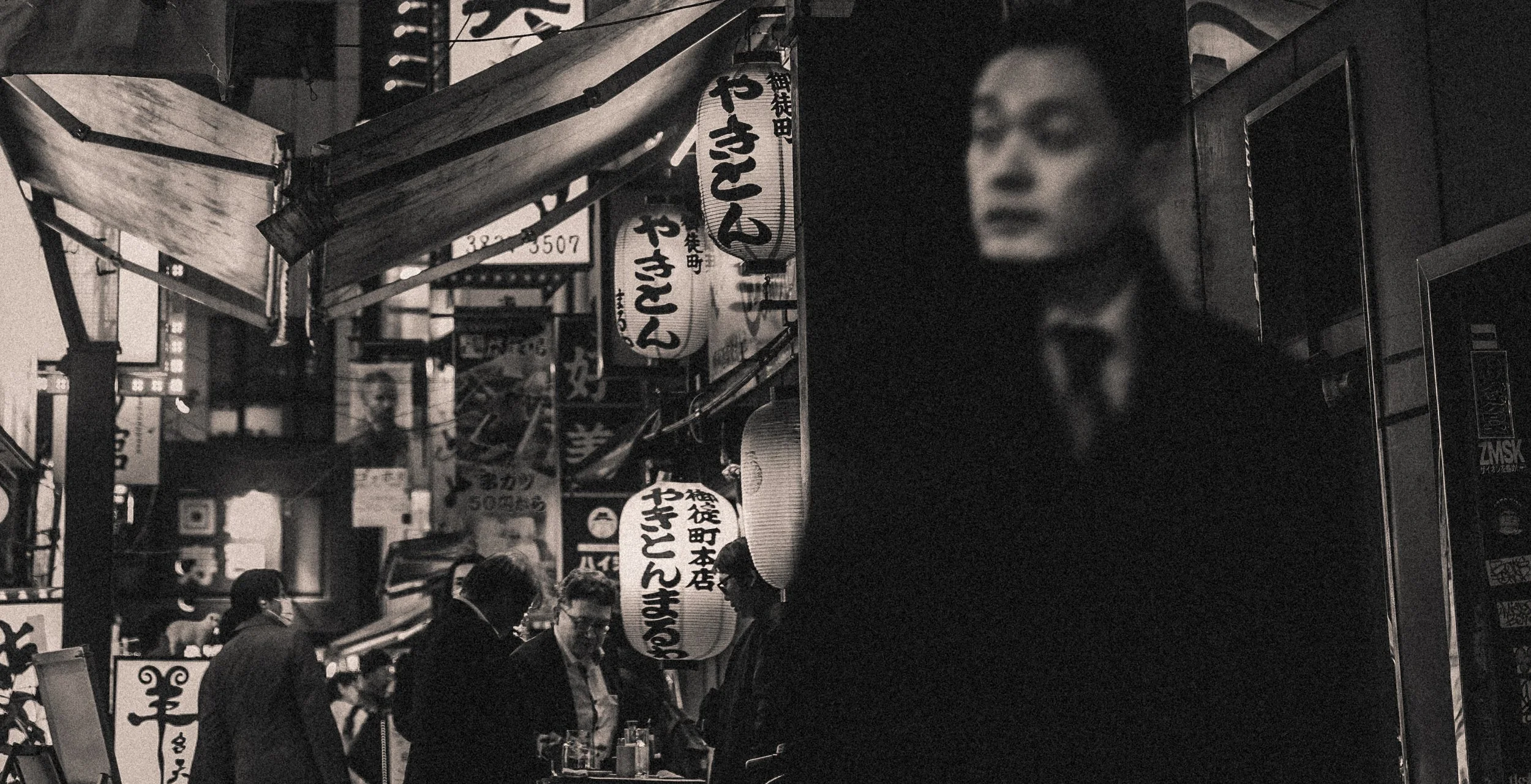 Busy Tokyo alley - black and white.jpg