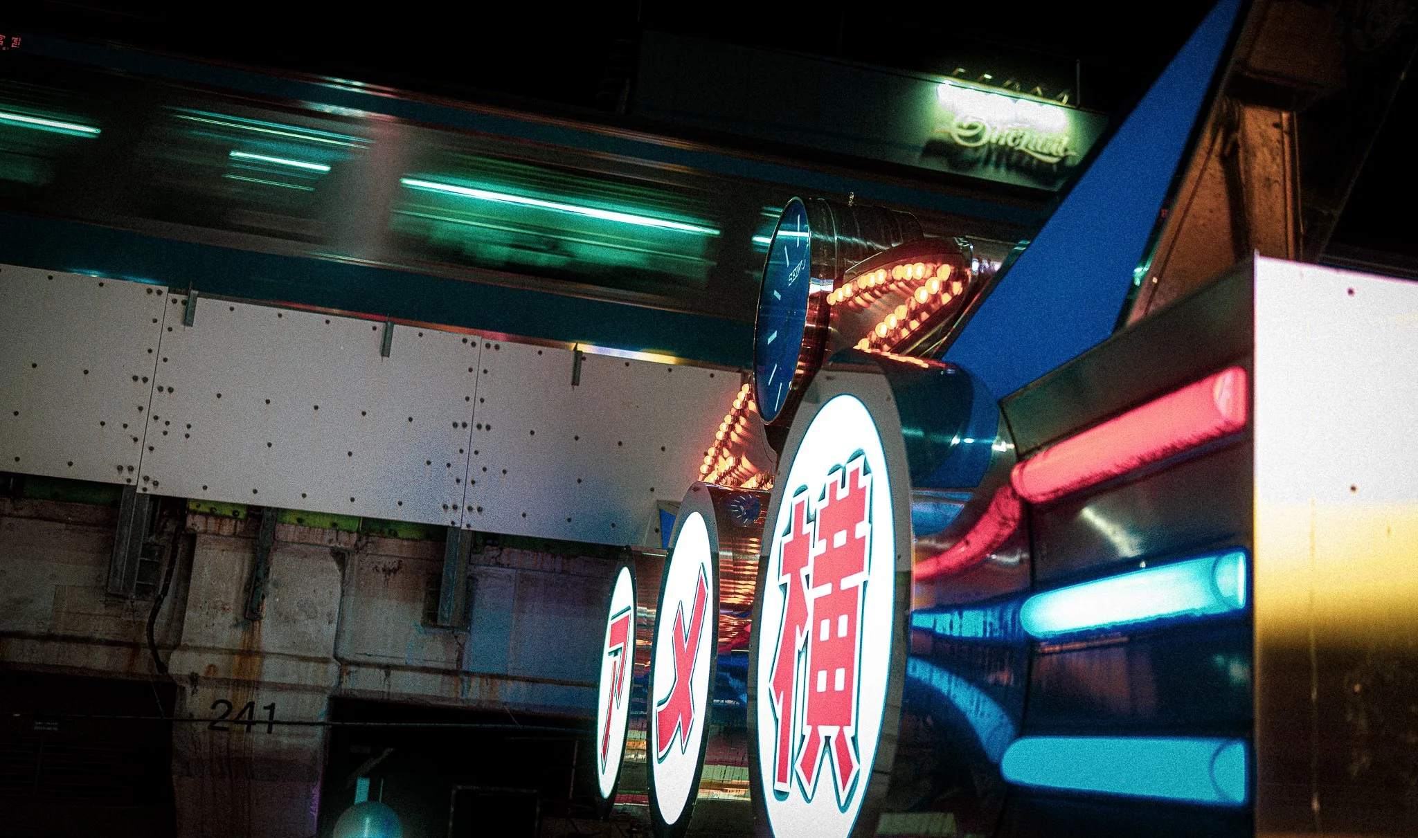Train passing by neon sign.jpg