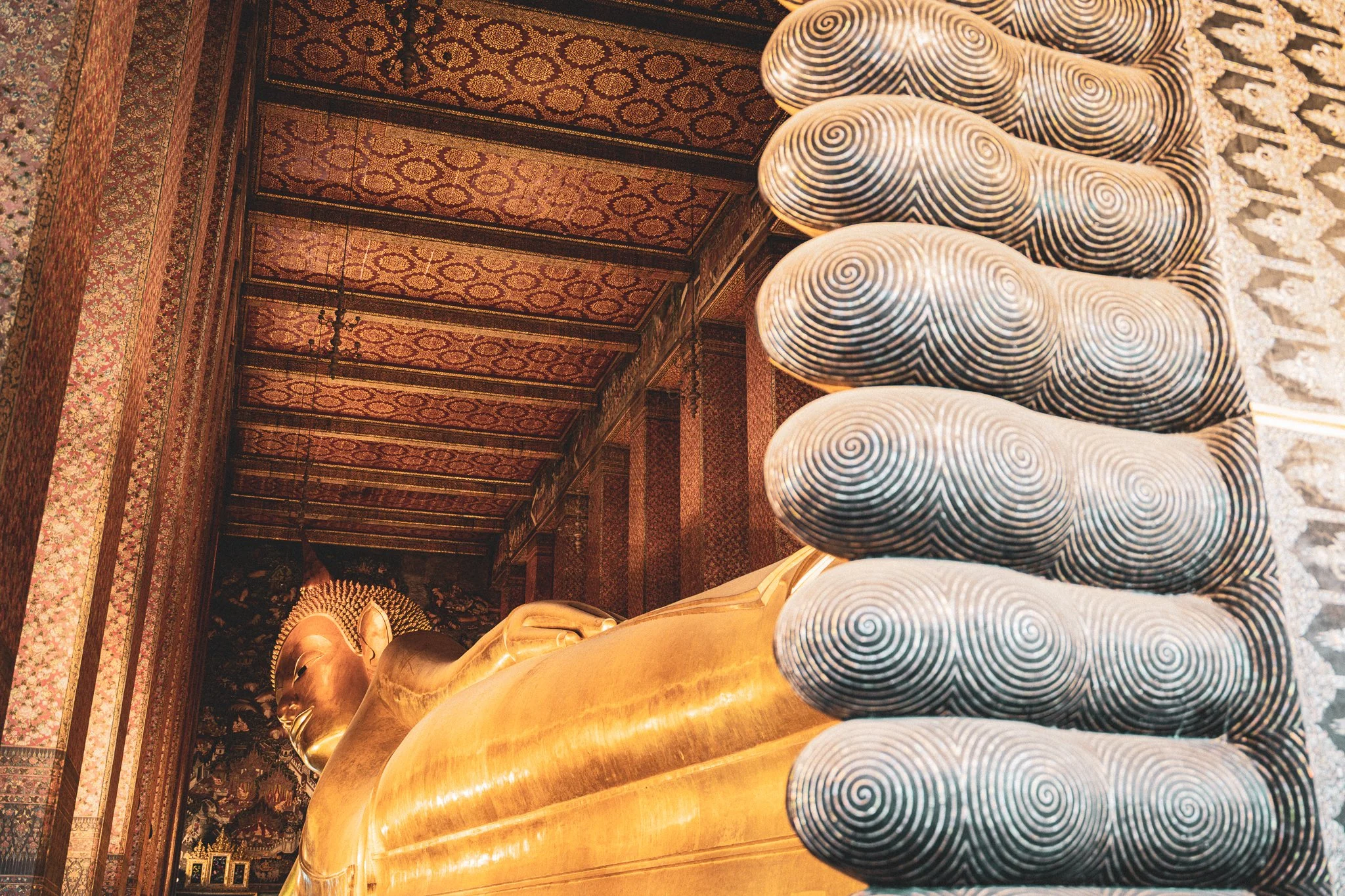 Wat Phra - Sleeping Buddha by feet.jpg