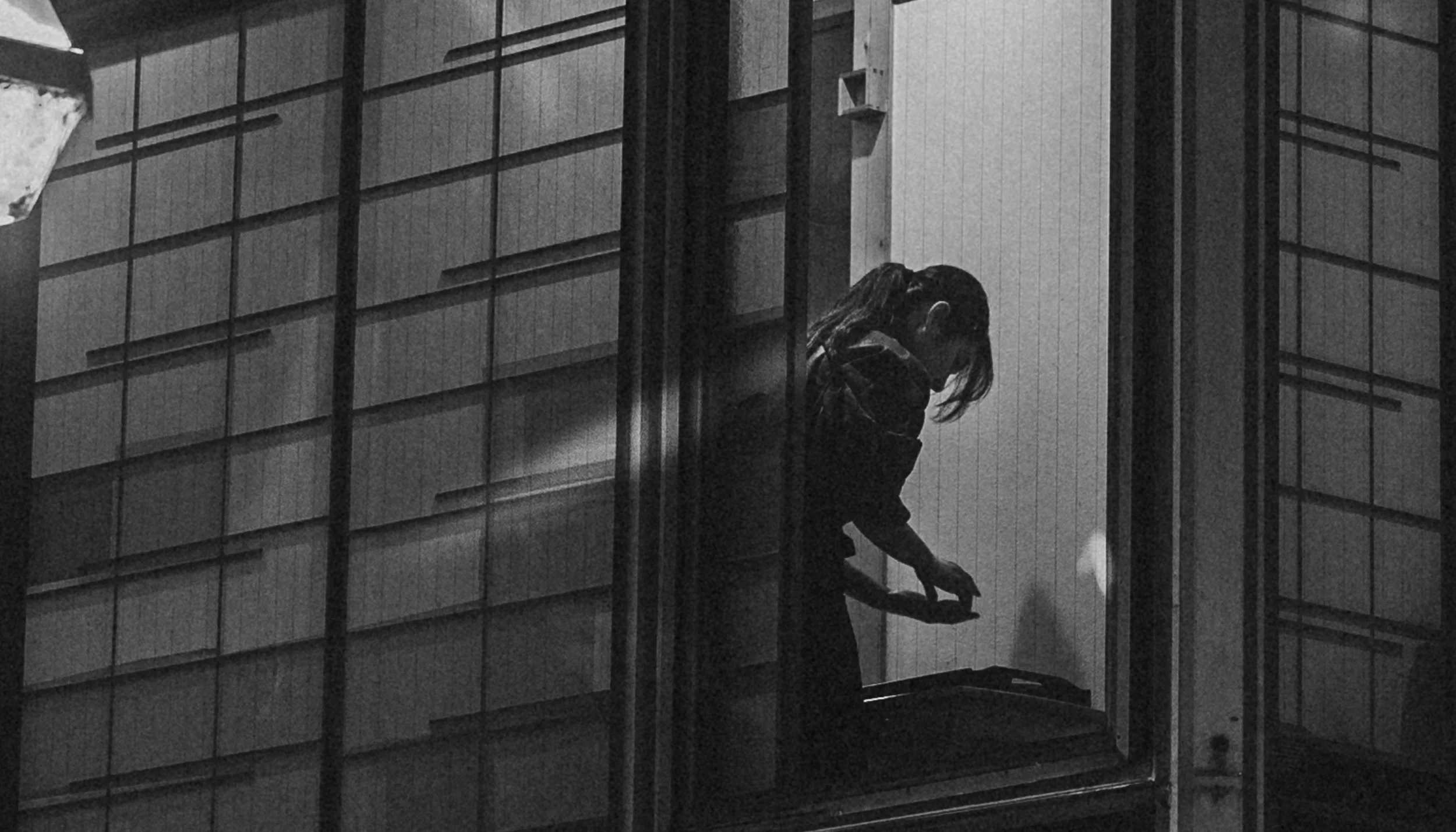 Lady preparing a meal by the window.jpg
